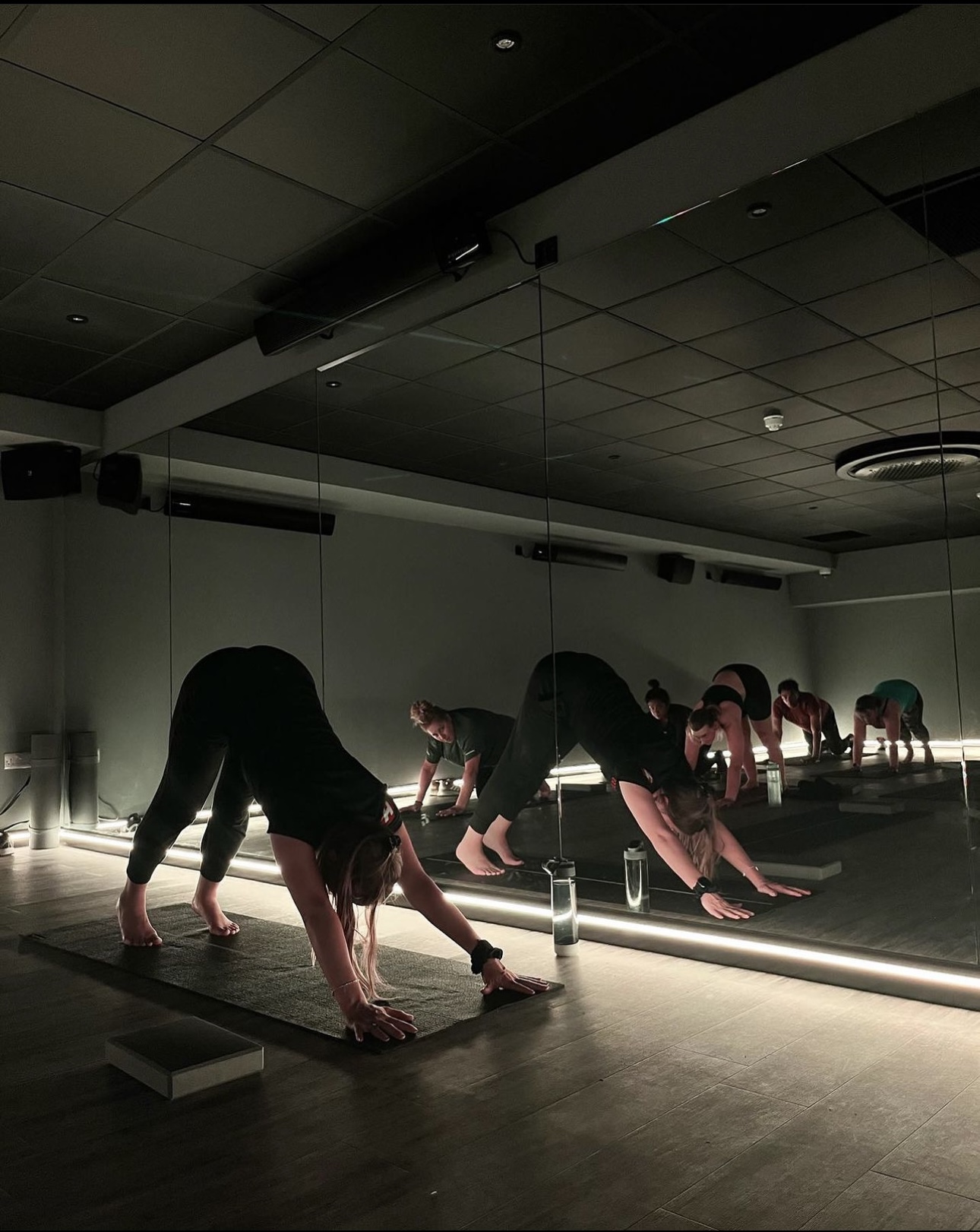 Minimalist corporate wellness yoga studio for professional fitness event sessions.
