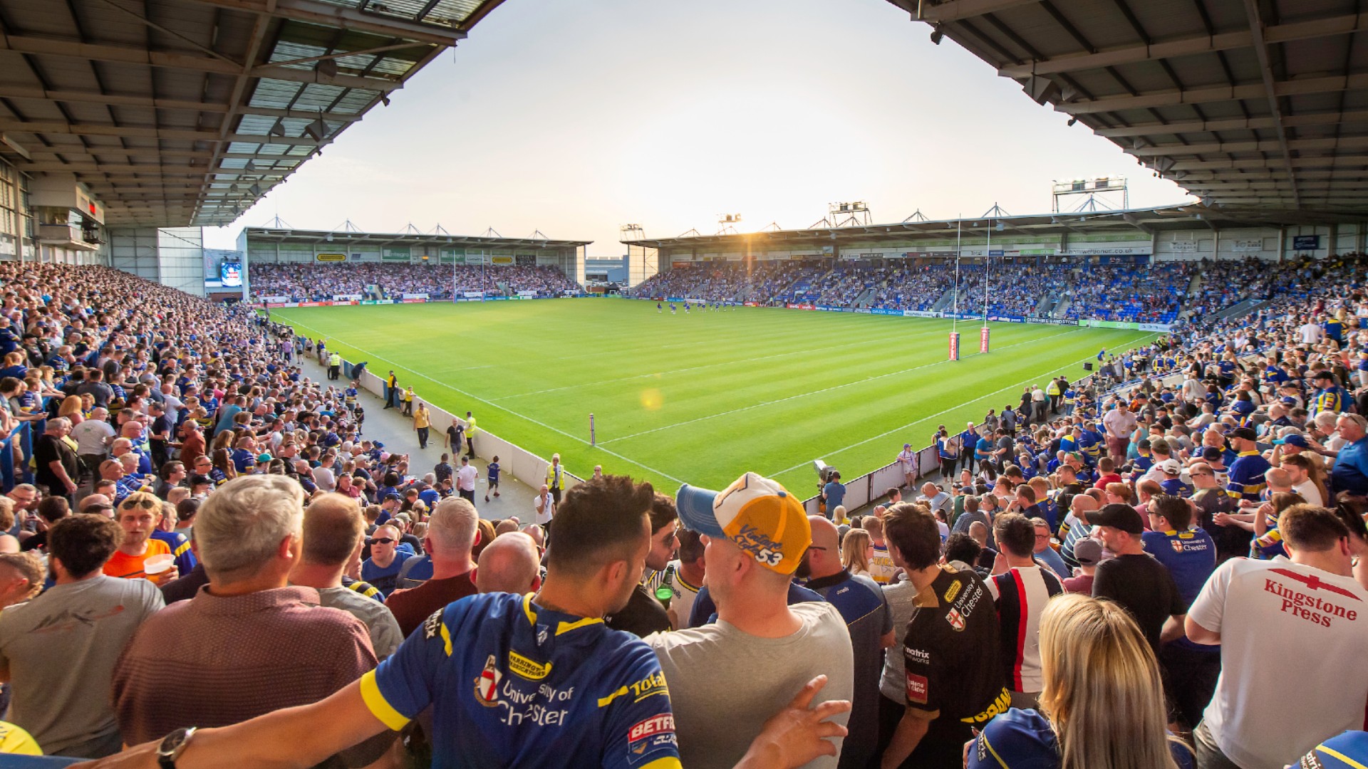 Halliwell Jones Stadium concourse: tiered seating for major sporting events and crowd management.