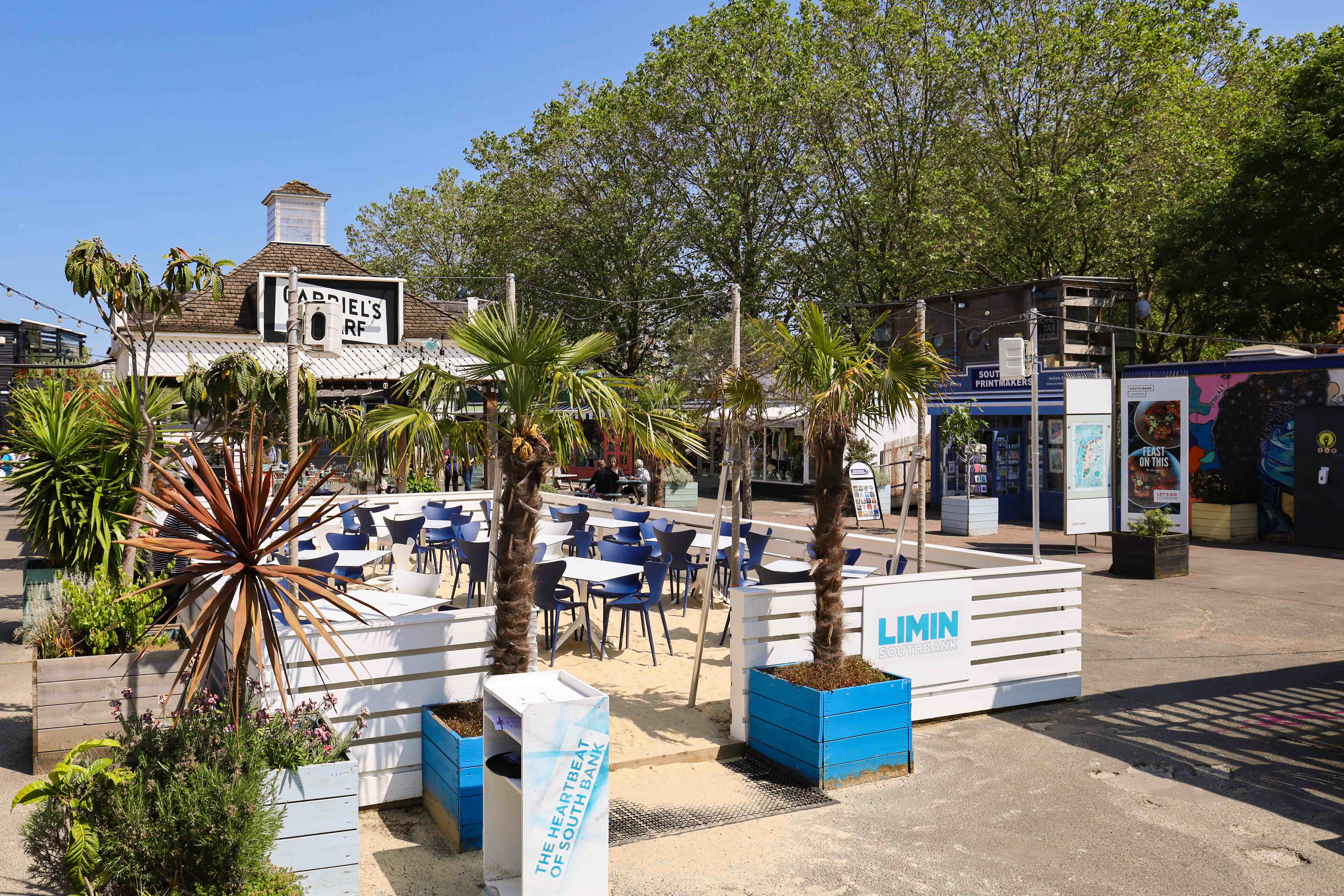 Coconut Grove event space in Southbank with palm trees and versatile seating arrangements.