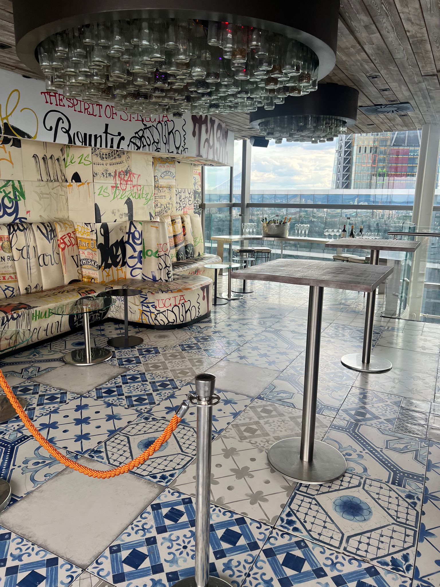 Semi-private bar event space with graffiti art and panoramic views at Duck & Waffle.