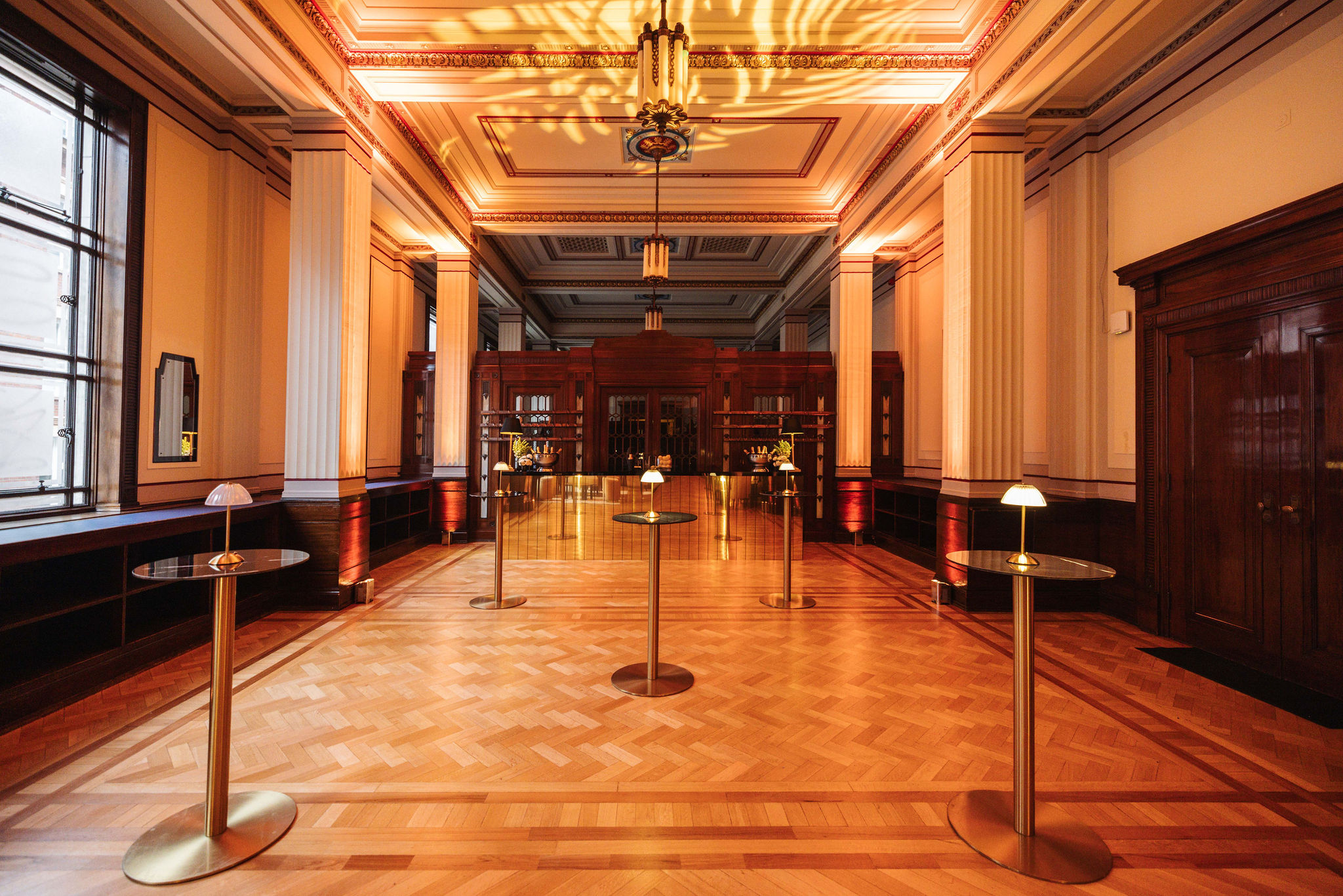 Elegant Long Room event space with polished wood, ideal for cocktail receptions and gatherings.