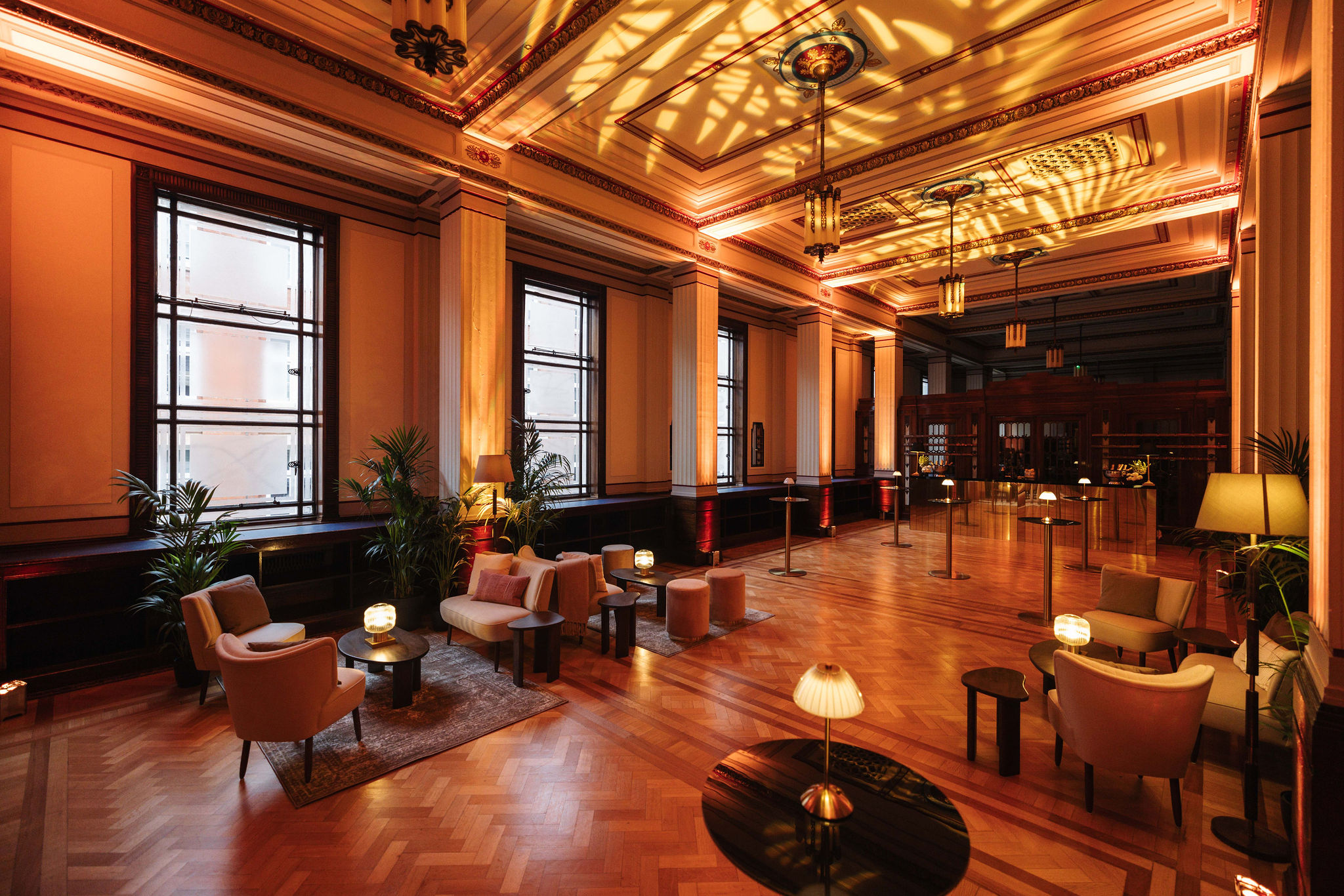 Elegant Long Room event space with warm lighting, ideal for receptions and gatherings.