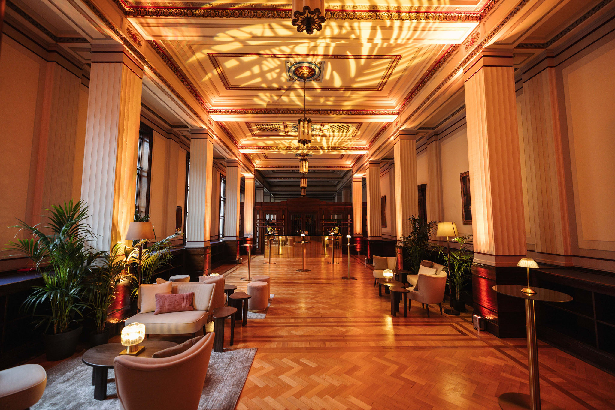 Elegant Long Room event space with warm lighting, perfect for gatherings or networking.
