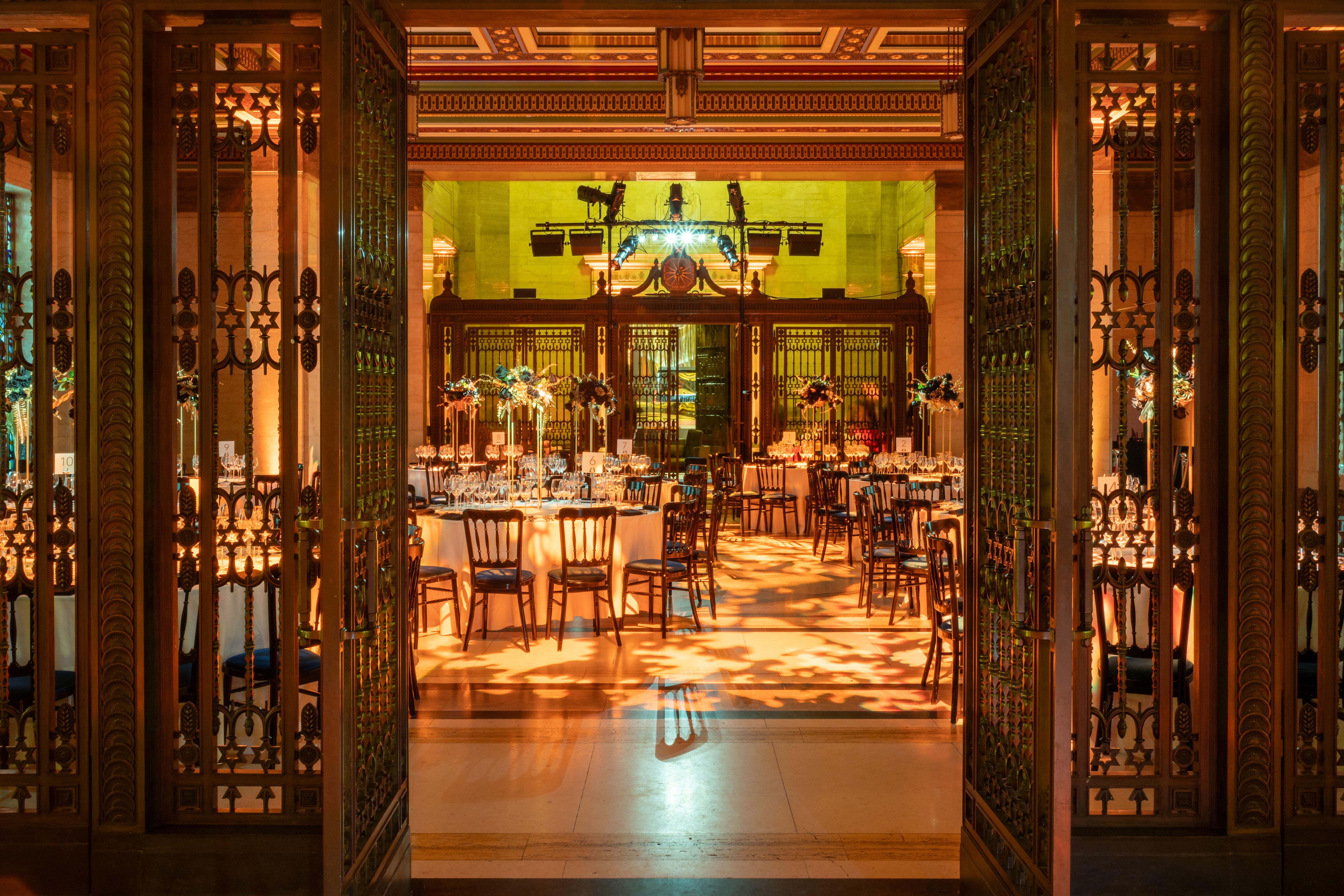 Elegant Long Room event space with chandeliers, ideal for galas or formal dinners.