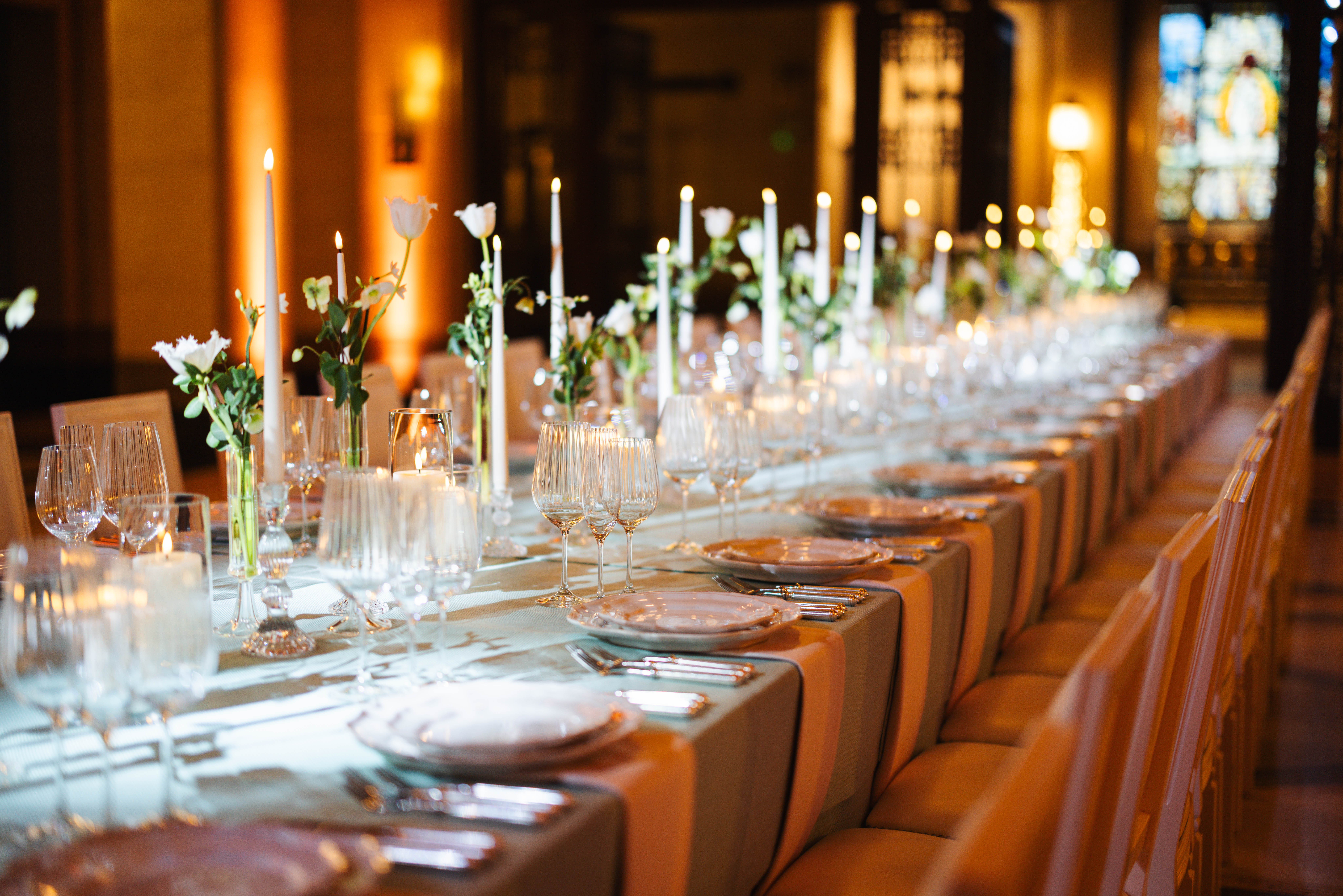 Elegant long table in The Long Room, with floral arrangements for formal events.