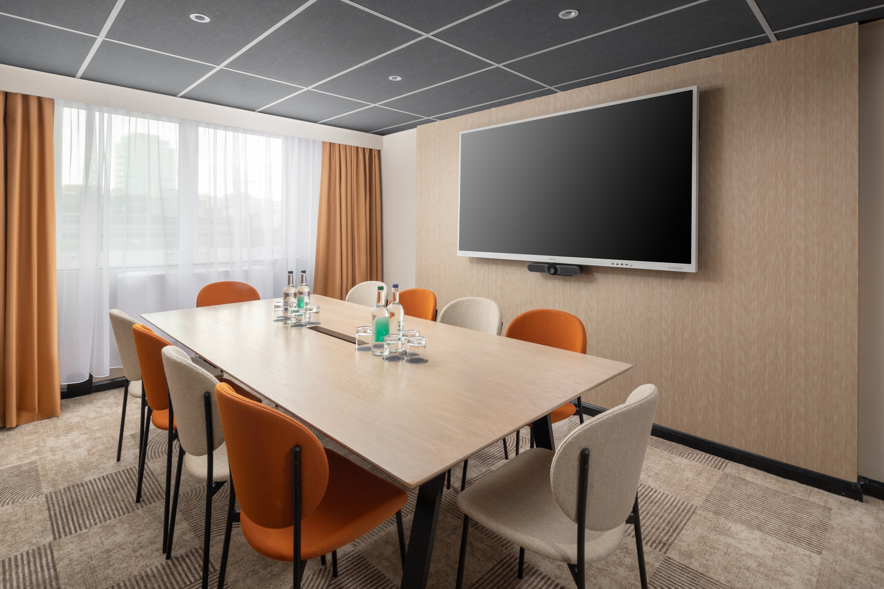 Regents Park Suite meeting room with large screen, ideal for corporate events and presentations.