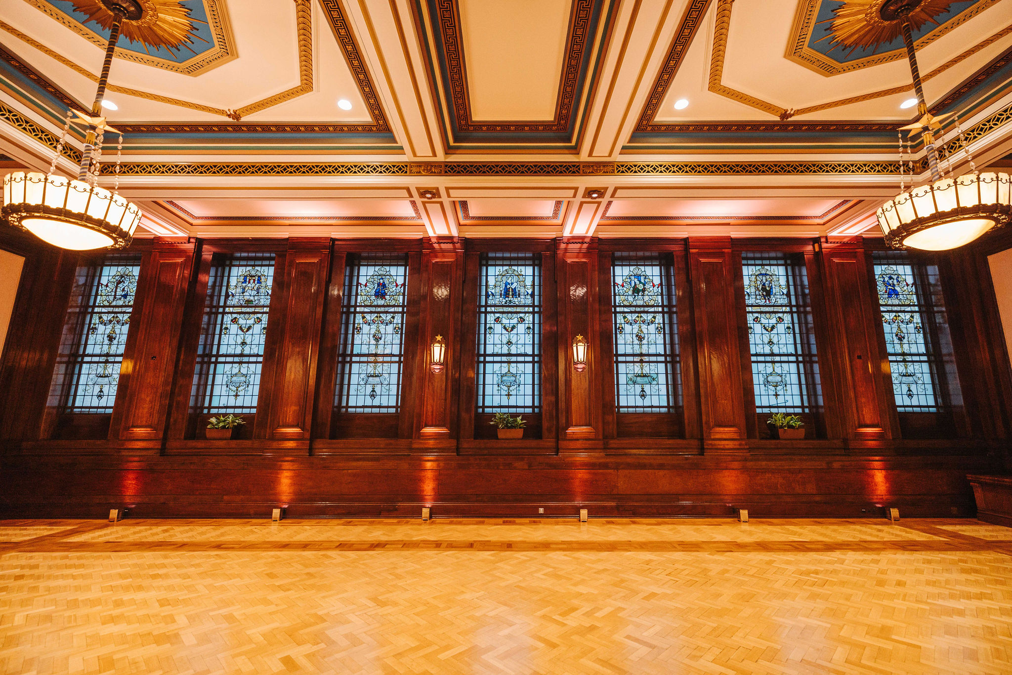 Elegant event space with stained glass windows for corporate gatherings at The Old Boardroom.