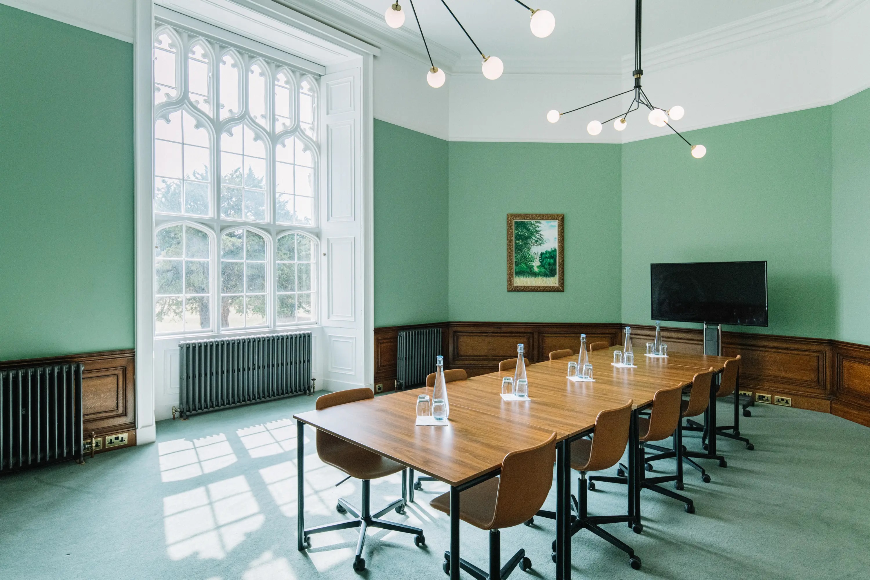 Bonar Law meeting room at Ashridge House, featuring a long wooden table and modern lighting.
