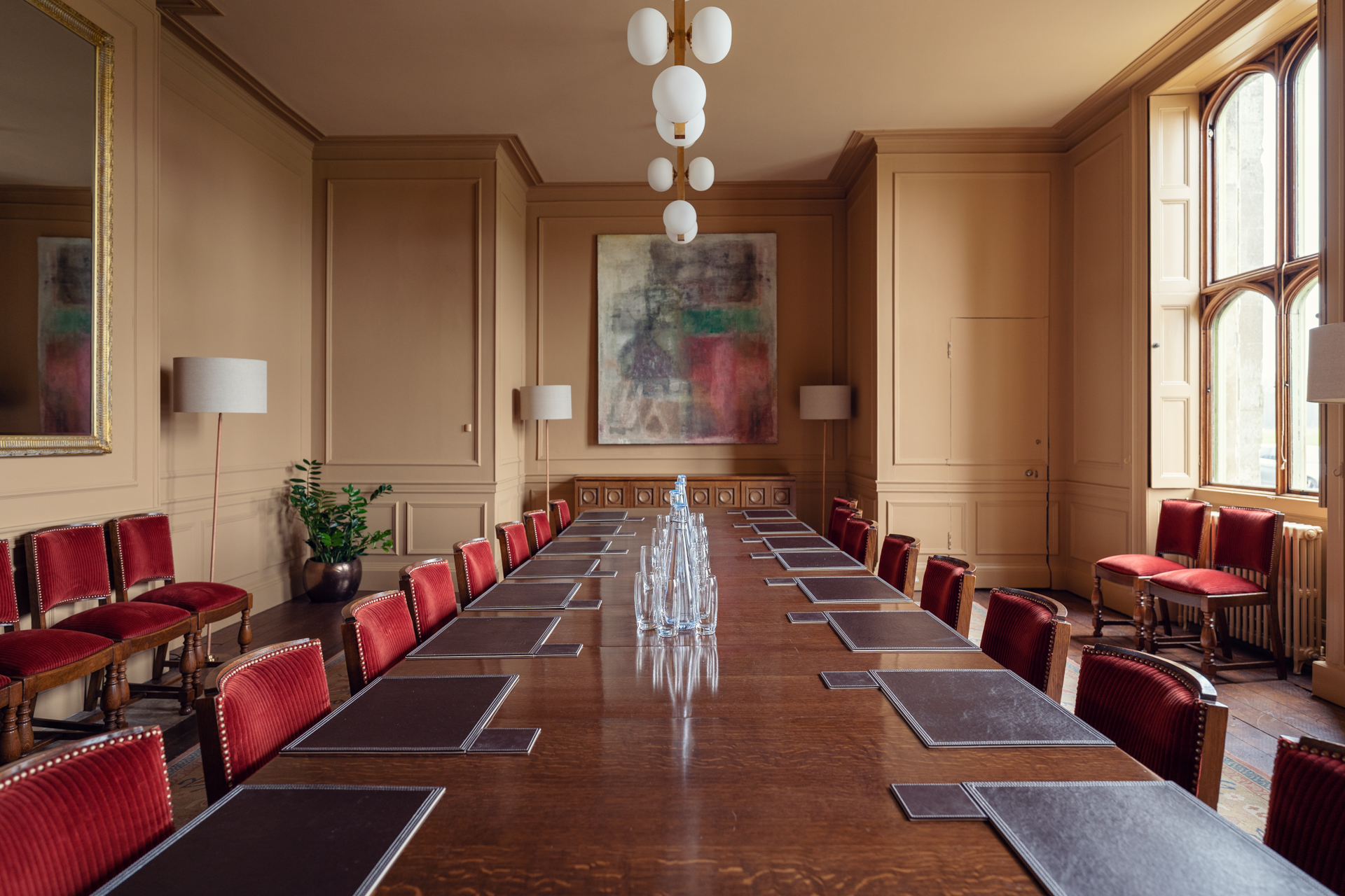 Boardroom at Ashridge House: elegant wooden table, ideal for meetings and events.
