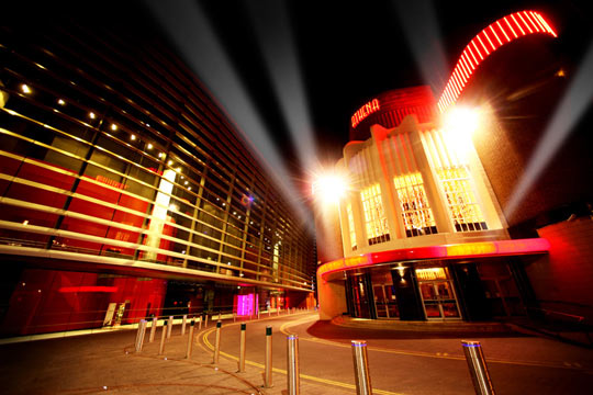 Modern event venue in Athena, illuminated at night for unforgettable celebrations.