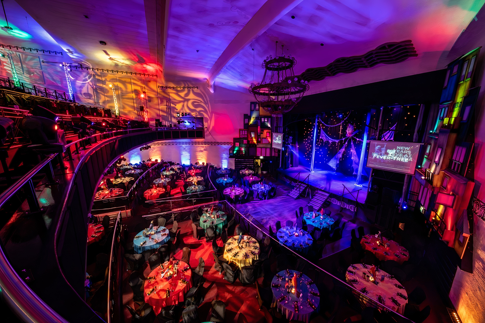 Elegant gala venue in Athena with vibrant decor and dynamic lighting for events.