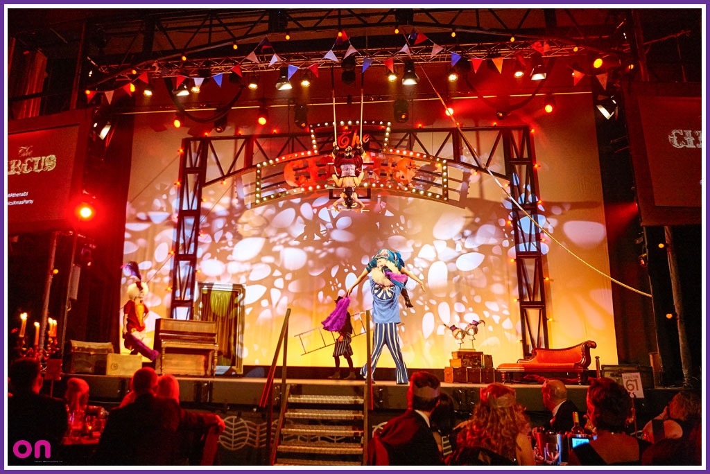 Circus-themed event space in Athena with dynamic lighting and engaging stage design.