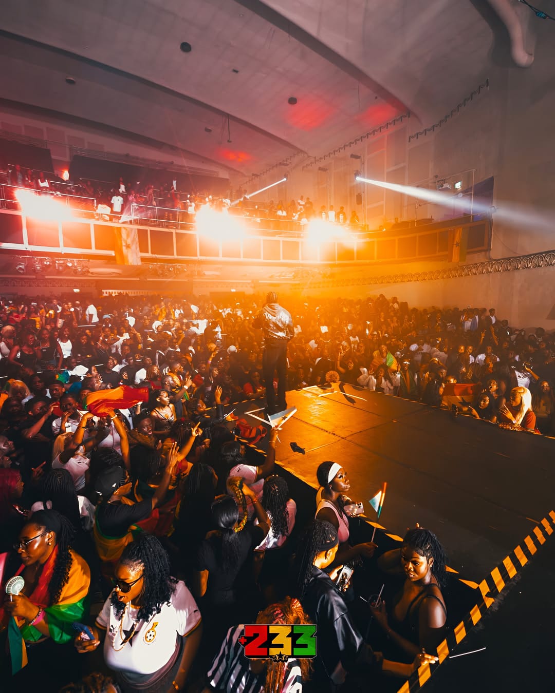 Vibrant concert scene at Whole Venue in Athena with dynamic lighting and enthusiastic crowd.