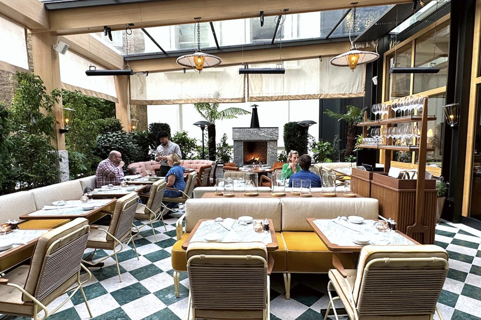 Dovetale Terrace at 1 Hotel Mayfair: elegant dining space with greenery for events and gatherings.