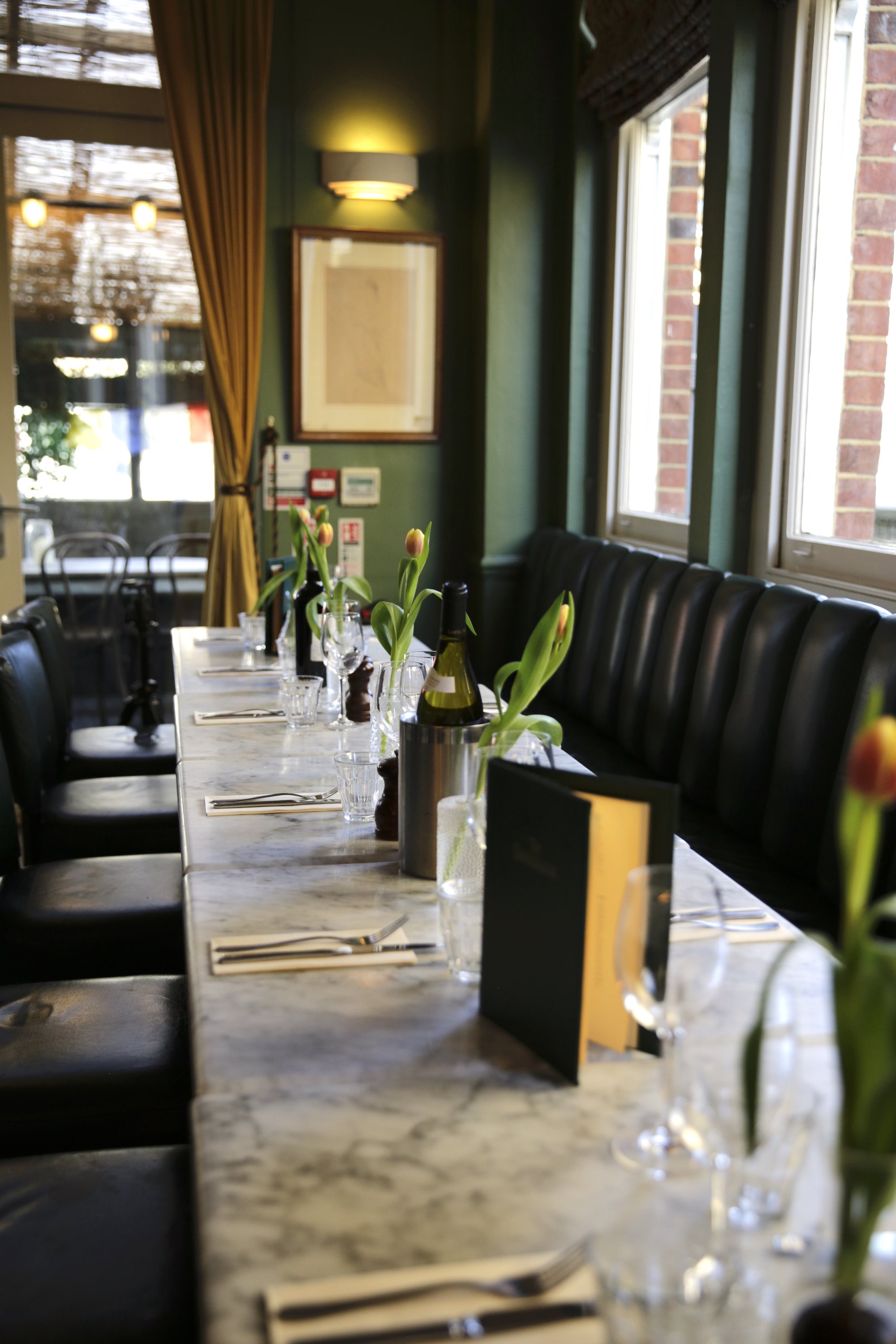Upscale booth seating at The Chamberlayne dining room for intimate private events and parties.