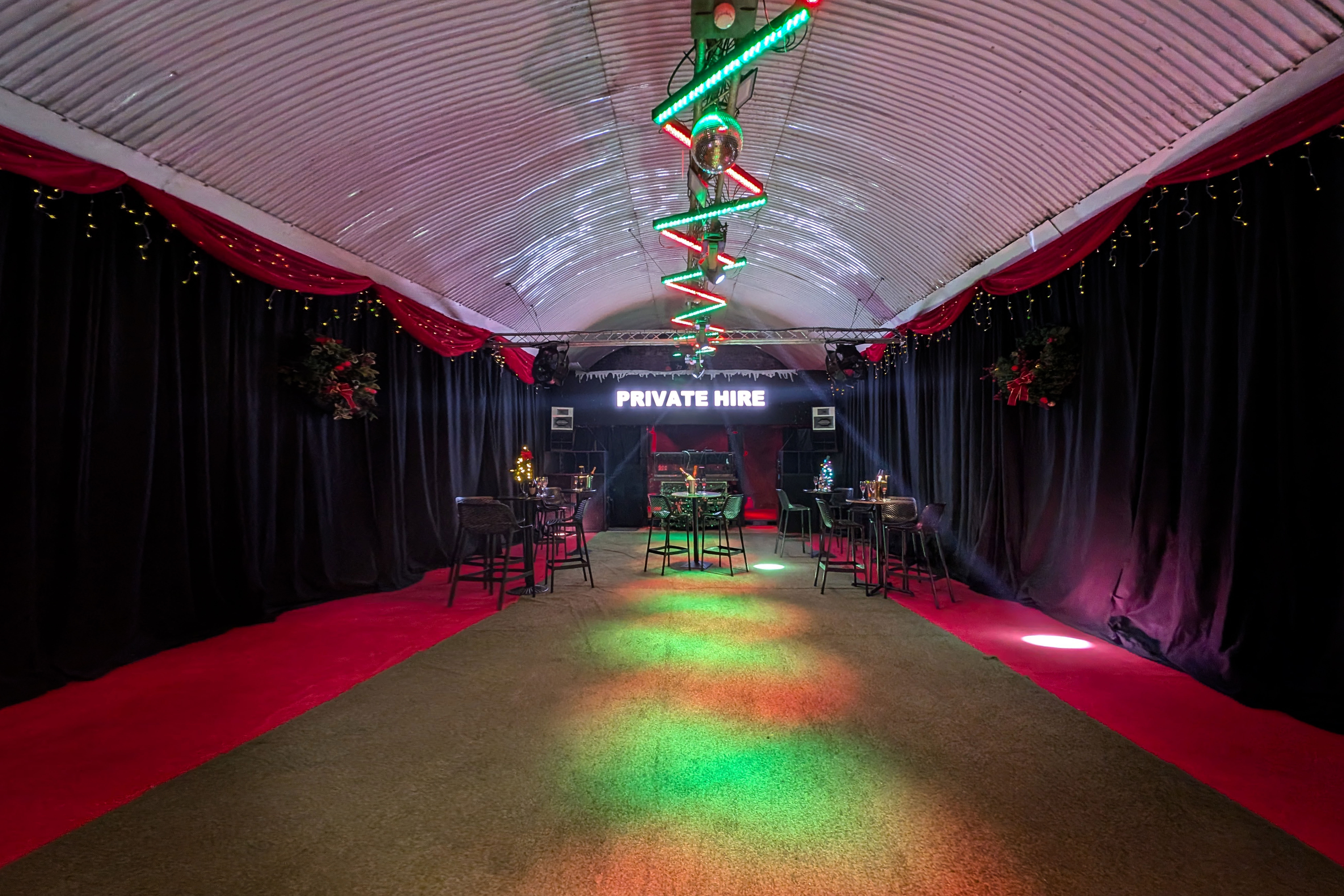 UnderTheArches Fibre industrial venue with vibrant lighting for private party or lounge reception.