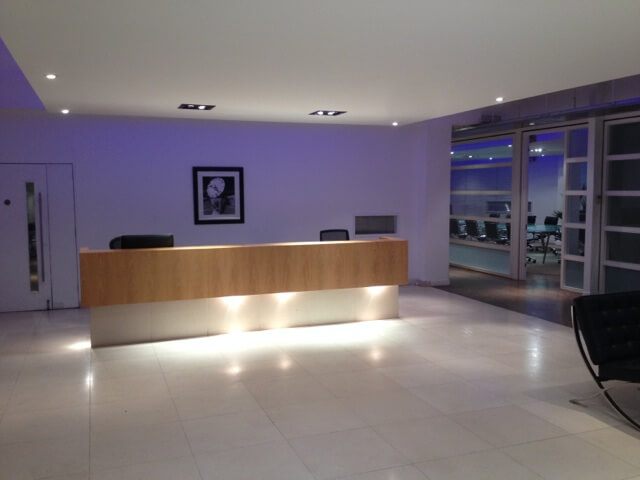Modern reception and boardroom at Matrix Studios for corporate event check-in and meetings.