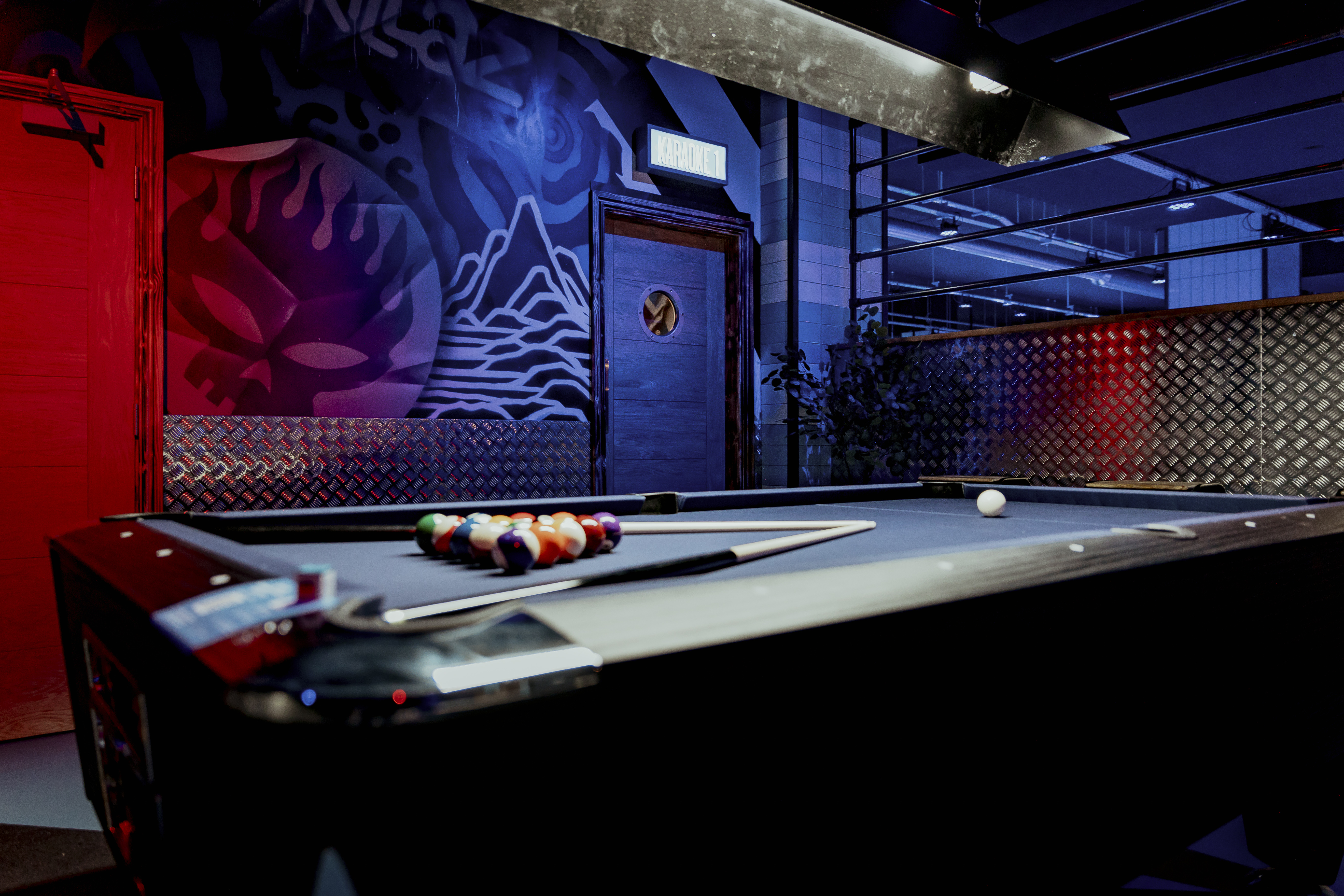 Modern pool table in vibrant Roxy Lanes, Nottingham for networking events and team building.
