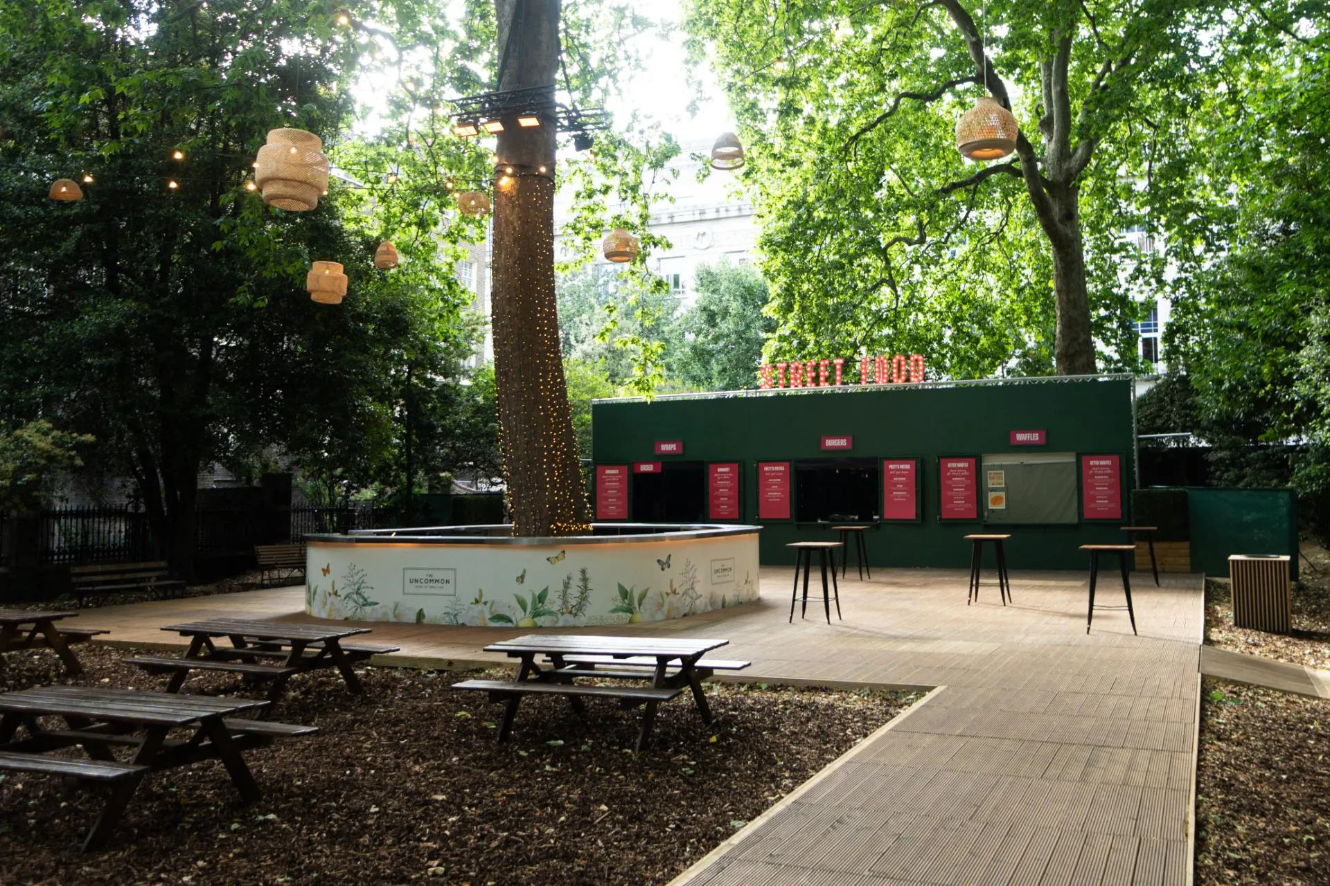 Summer party networking reception with bistro seating in Sunken Garden Bloomsbury.