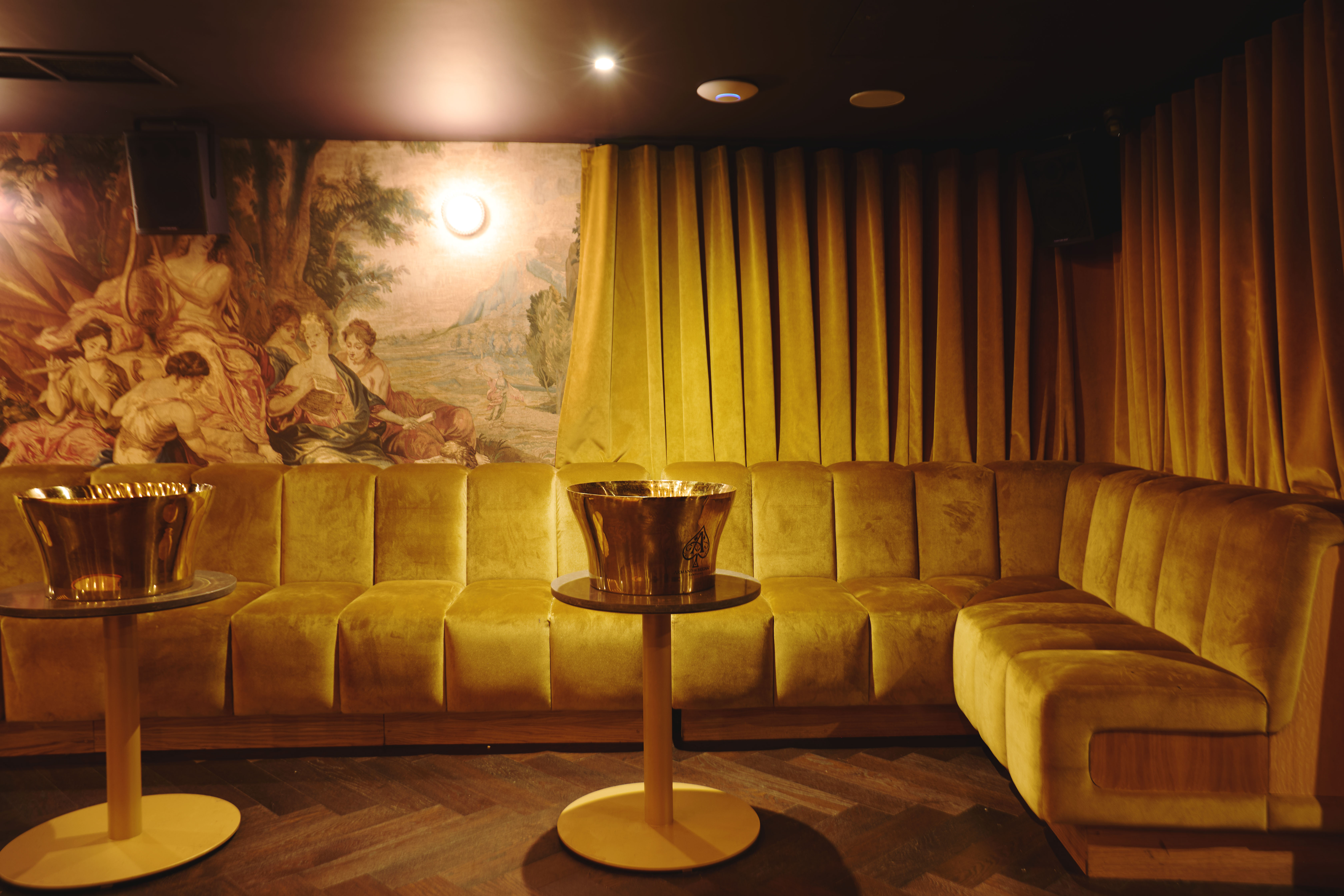 VIP bowling room with plush velvet seating, ideal for luxury networking and exclusive events.