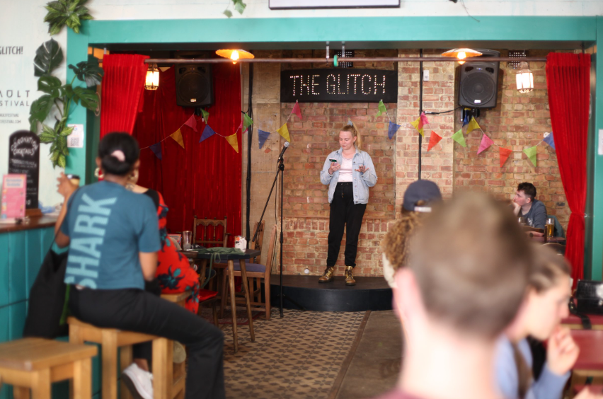 Vibrant rehearsal space with speaker, ideal for networking and creative events.