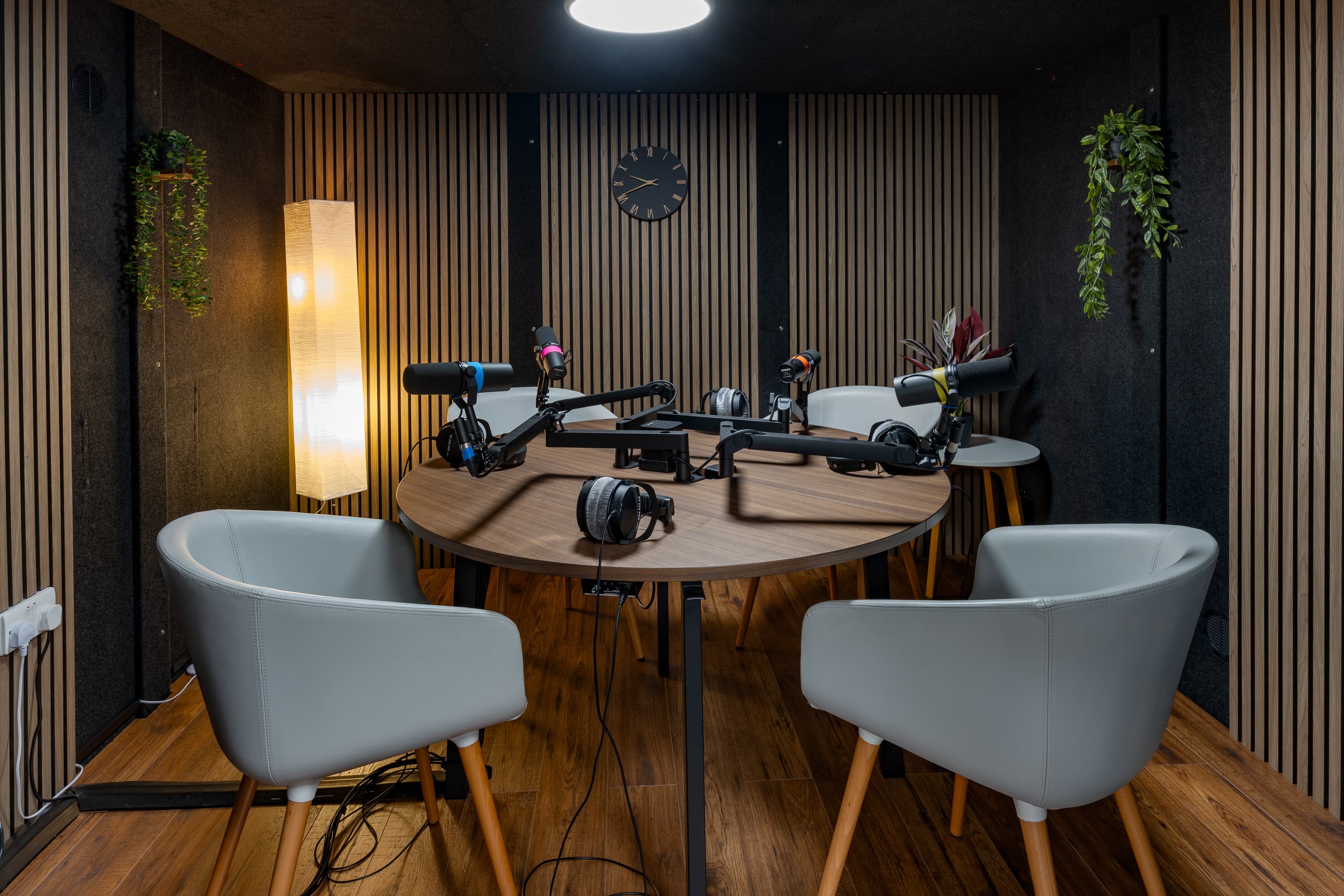 Professional sound-treated podcast studio for collaborative content creation and audio recording.