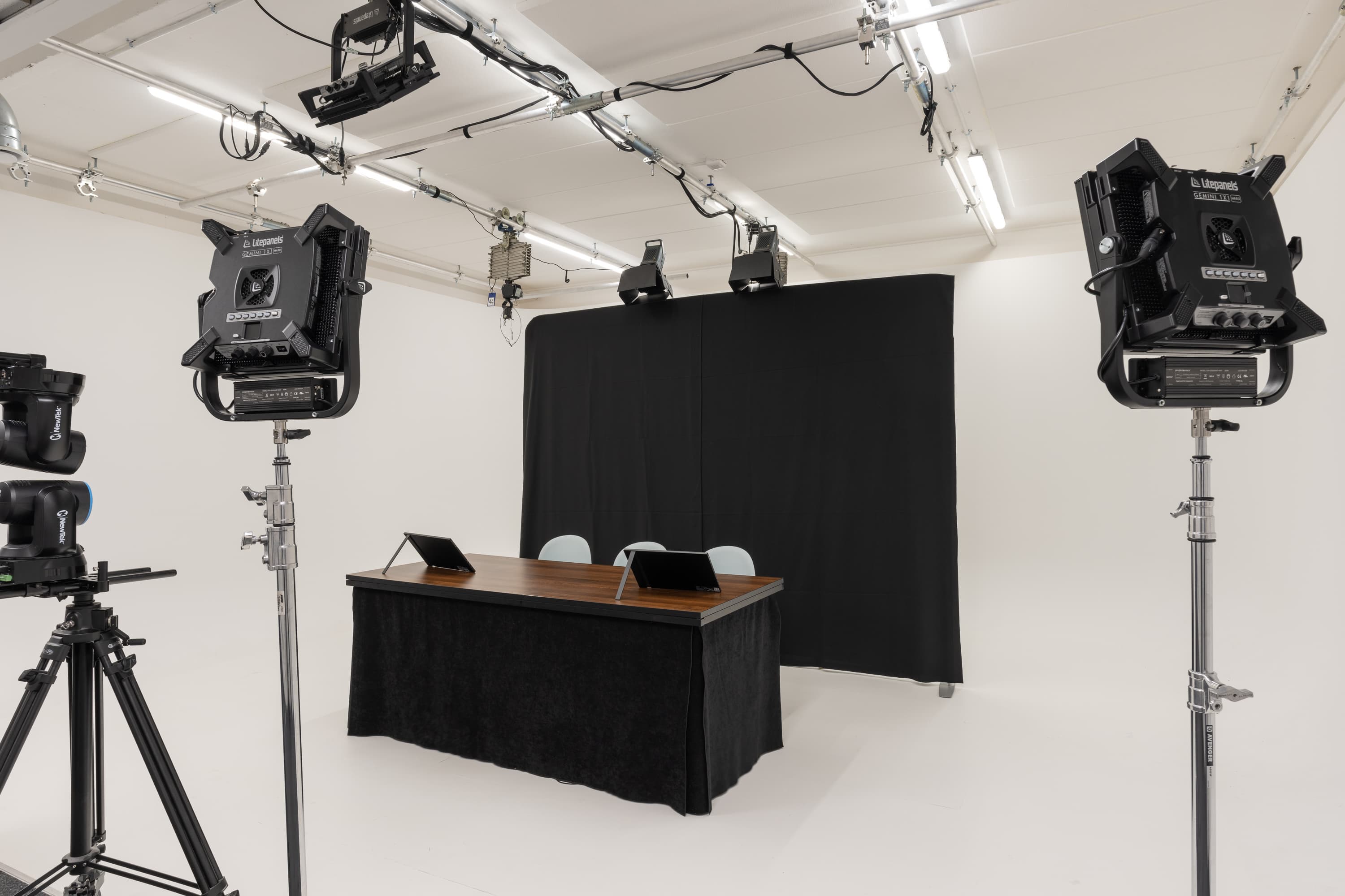 Virtual studio at 10 Union Street with stage lighting for hybrid events and panel discussions.