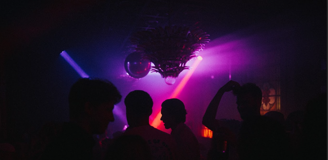 Vibrant event space at The Old Queen's Head with dynamic lighting for lively parties.