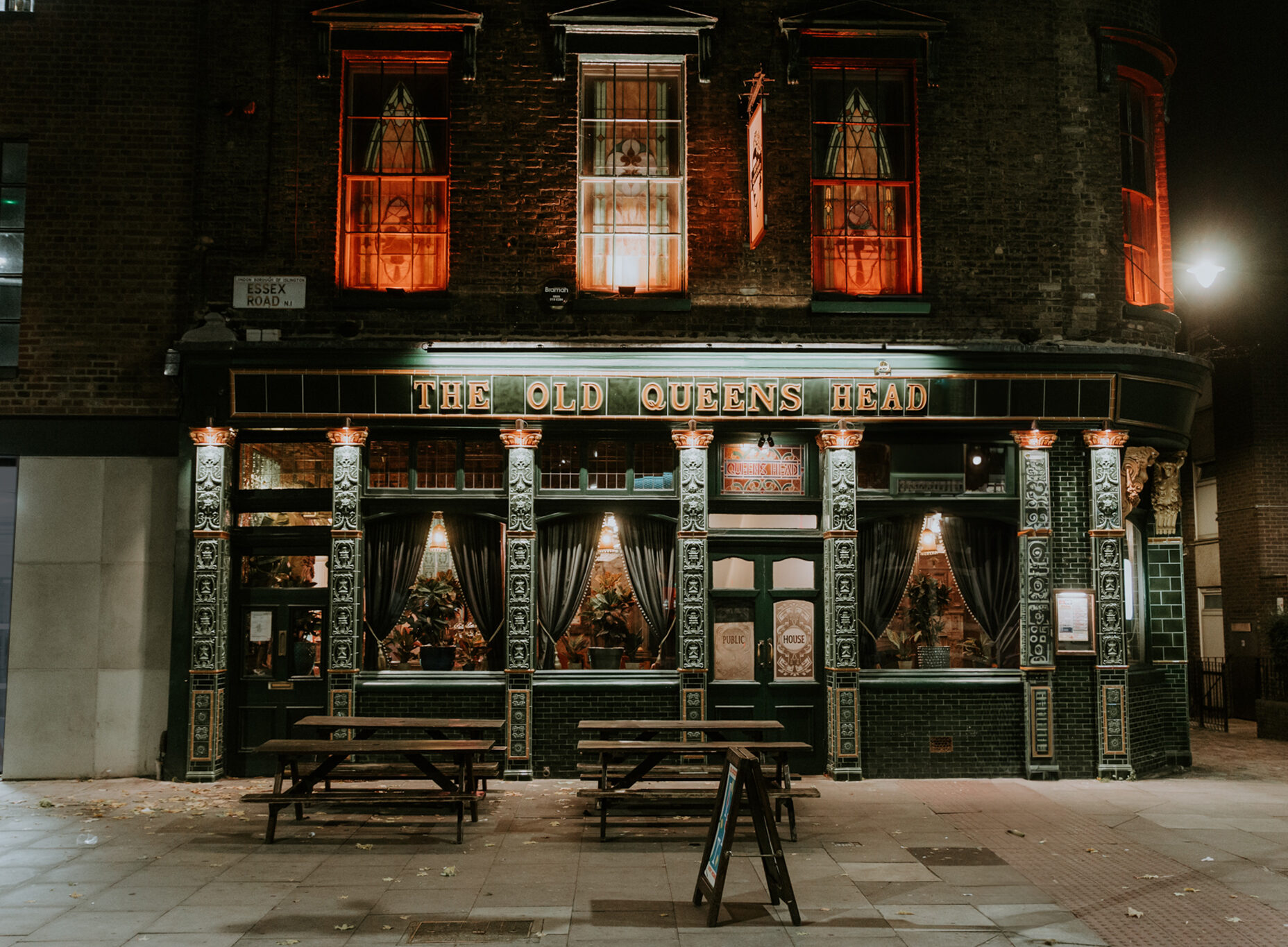 Charming pub exterior of The Old Queen's Head, ideal for social events and gatherings.