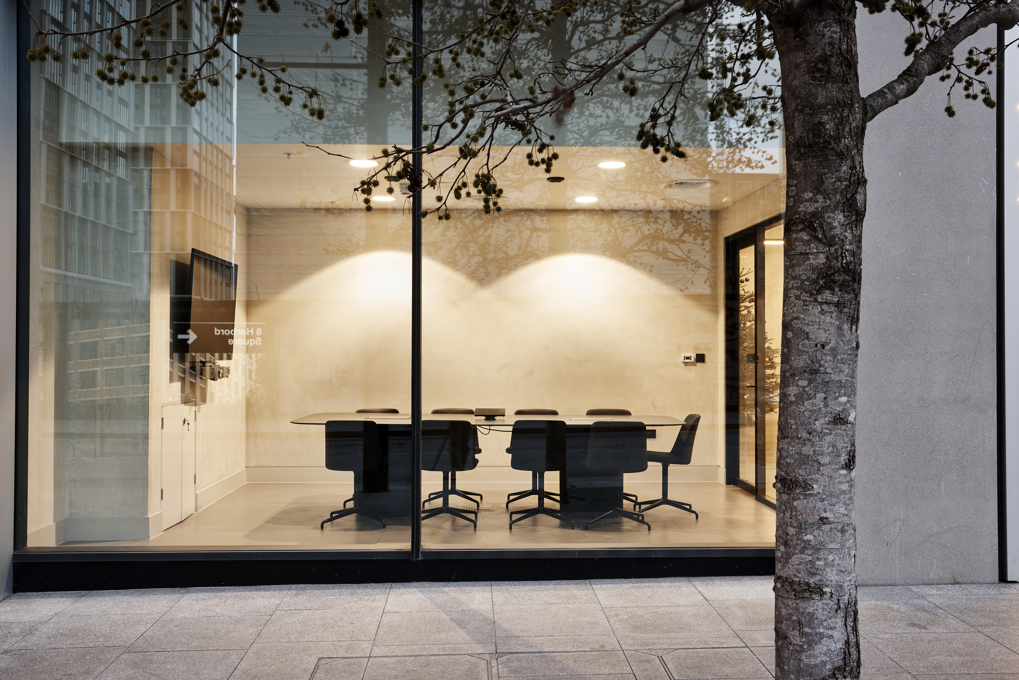 Modern conference room with glass walls at Broadwick Studio for corporate meetings.