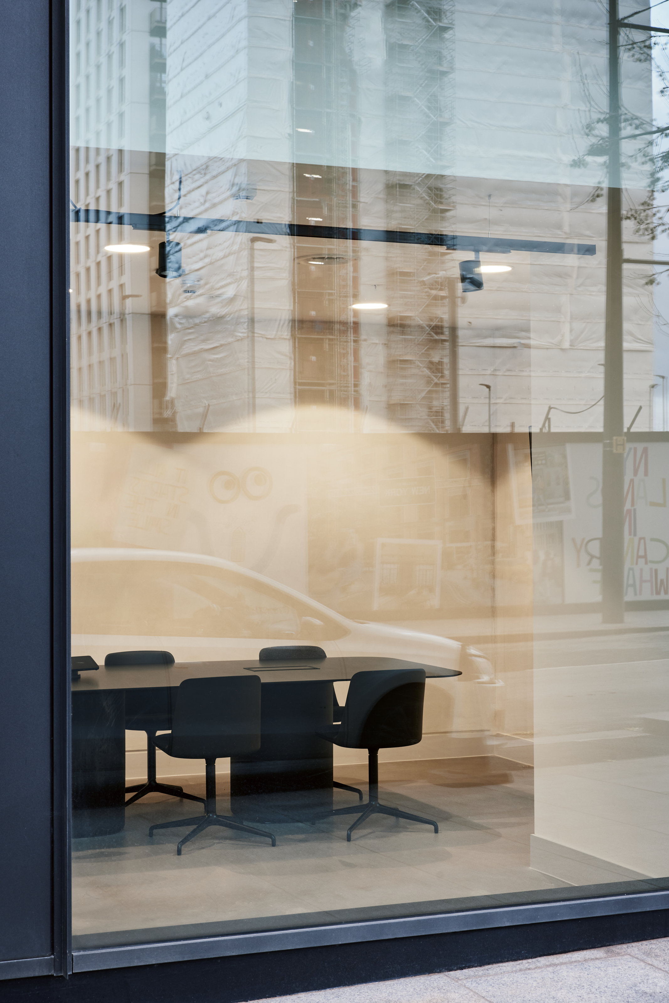 Modern meeting room with glass walls for professional gatherings at Broadwick Studio.