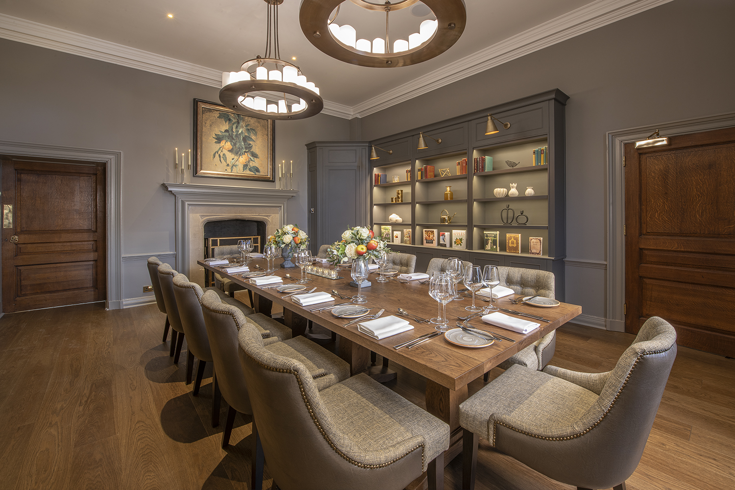 Elegant Manor Library meeting space with wooden table, perfect for corporate events.