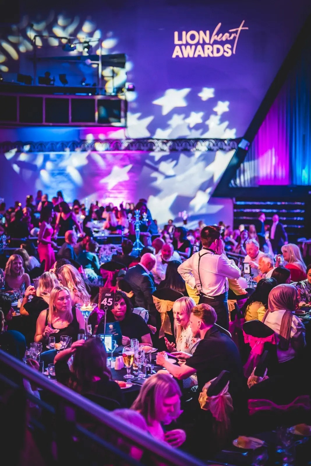 Vibrant networking event at Athena Space with elegantly set tables and engaged attendees.