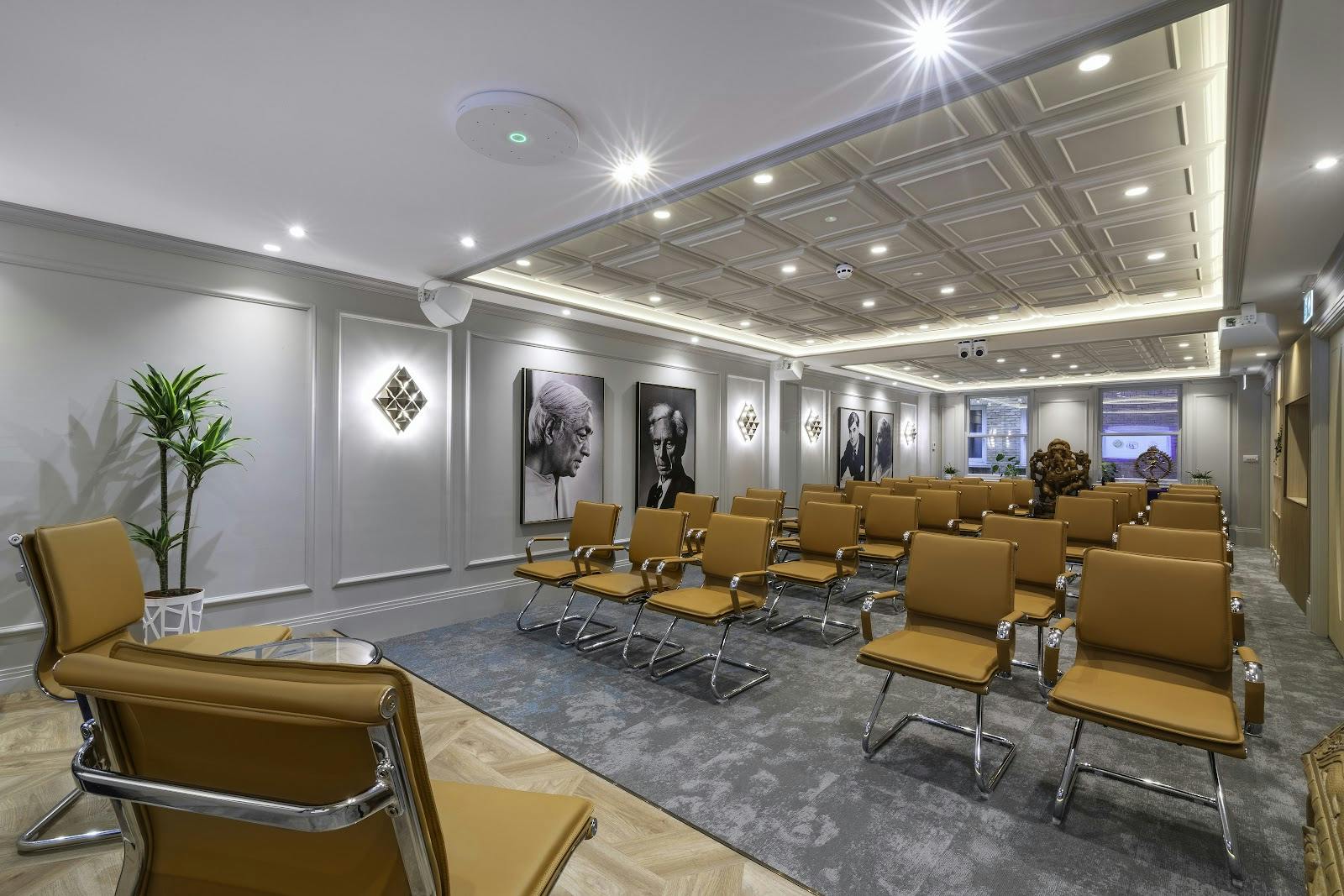Upscale theater-style event space with ergonomic seating for executive meetings and workshops.