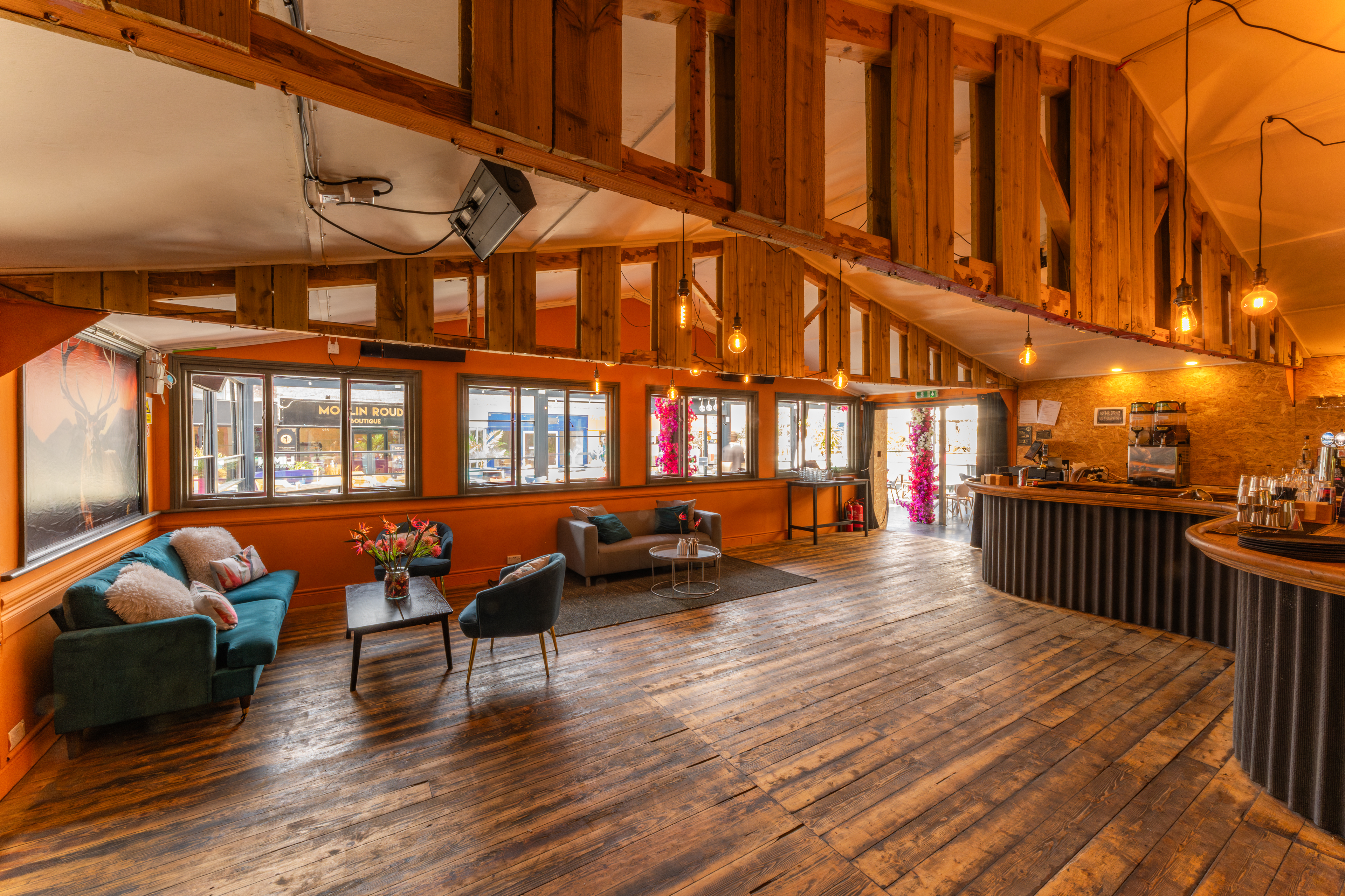 "Bird of Paradise Bar event space with warm wooden accents for networking and gatherings"