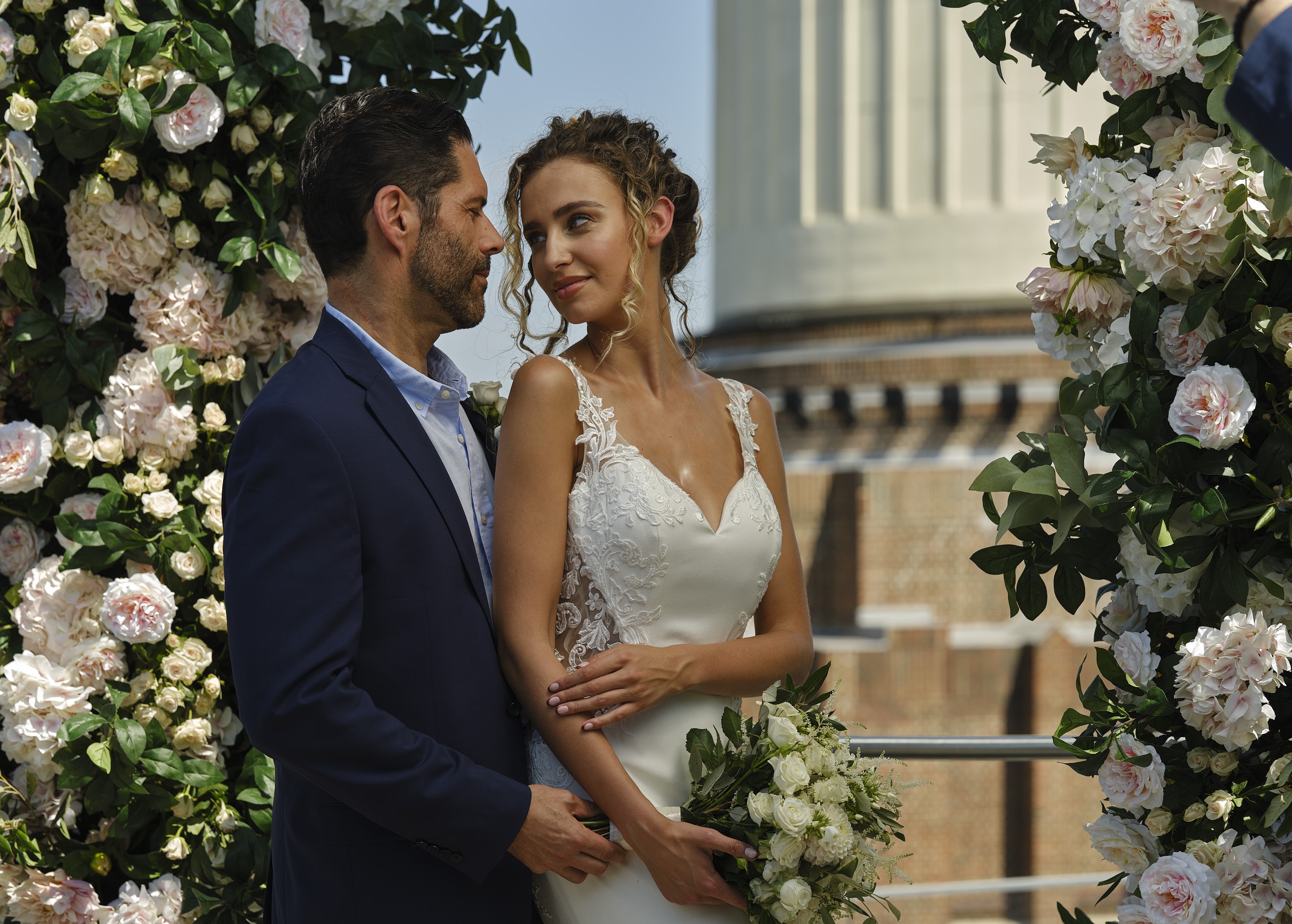 Wedding ceremony at JOIA Rooftop, art'otel London, with lush floral arrangements.