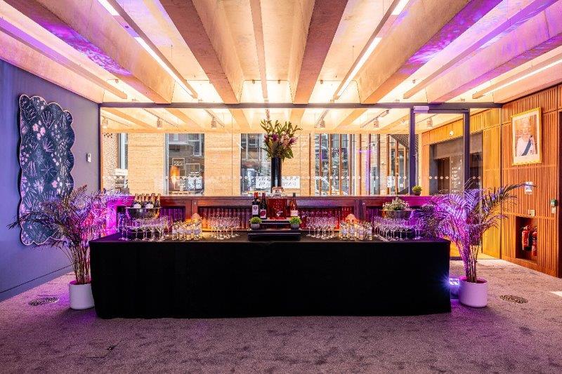 Stylish Library Meeting Room with elegant bar setup for networking and celebratory events.