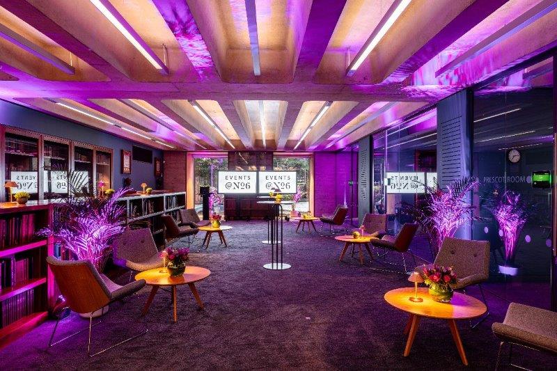 Modern Library Meeting Room with purple lighting for versatile professional events.