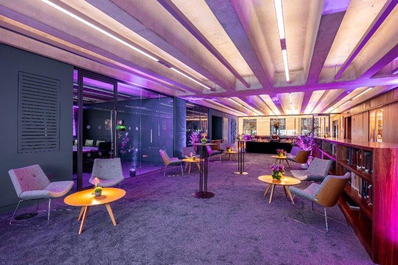 Modern Library Meeting Room with ambient lighting for networking events and receptions.