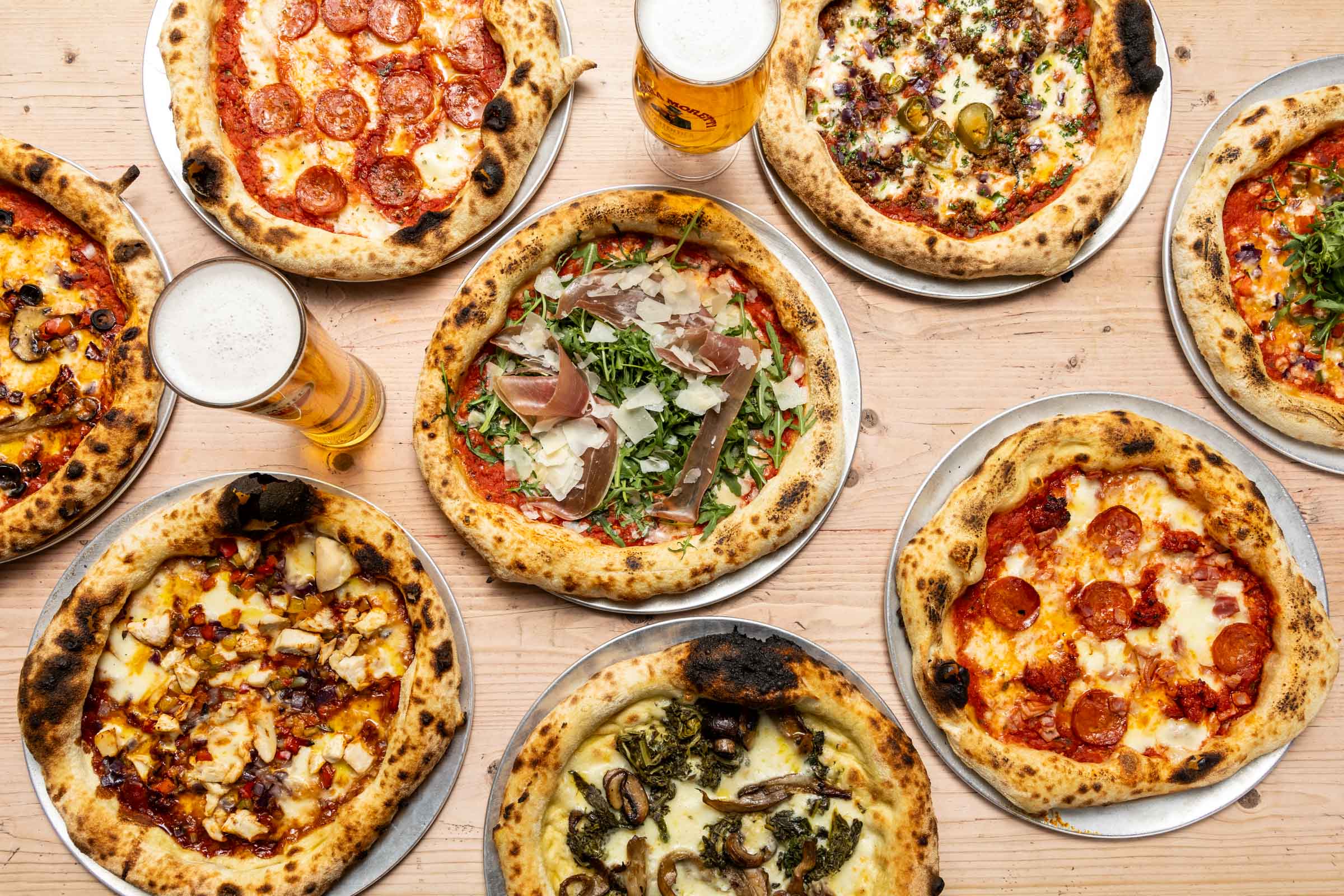 Gourmet pizzas and craft beers at Players Lounge, Bat & Ball Covent Garden networking event.