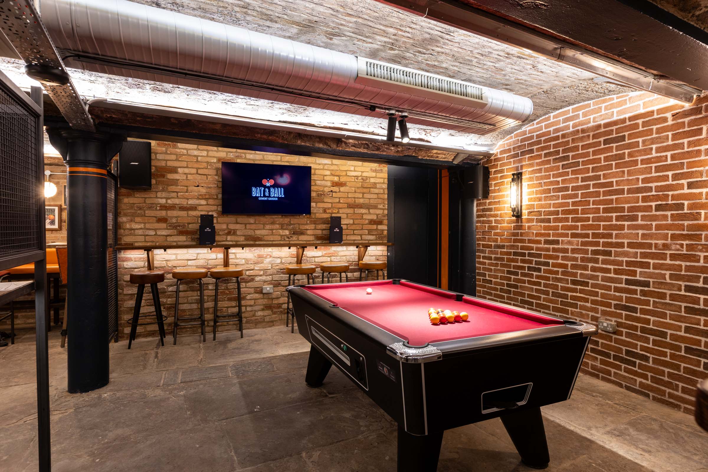 Modern event space with pool table at Players Lounge, perfect for networking or team-building.