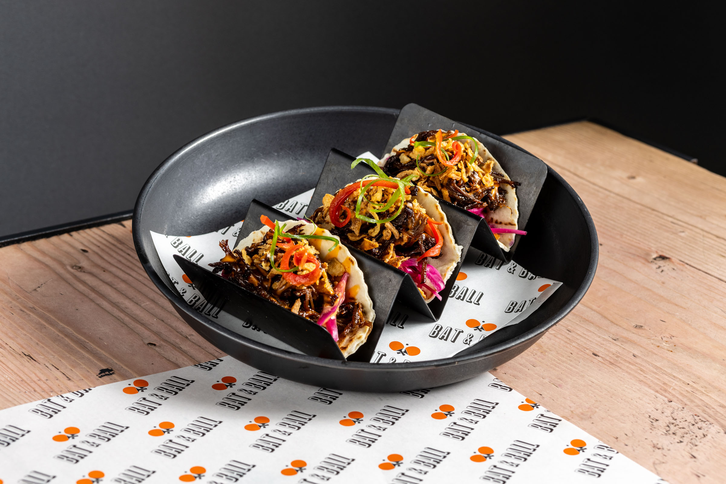 Gourmet tacos in a sleek bowl at Players Lounge, perfect for catered events.
