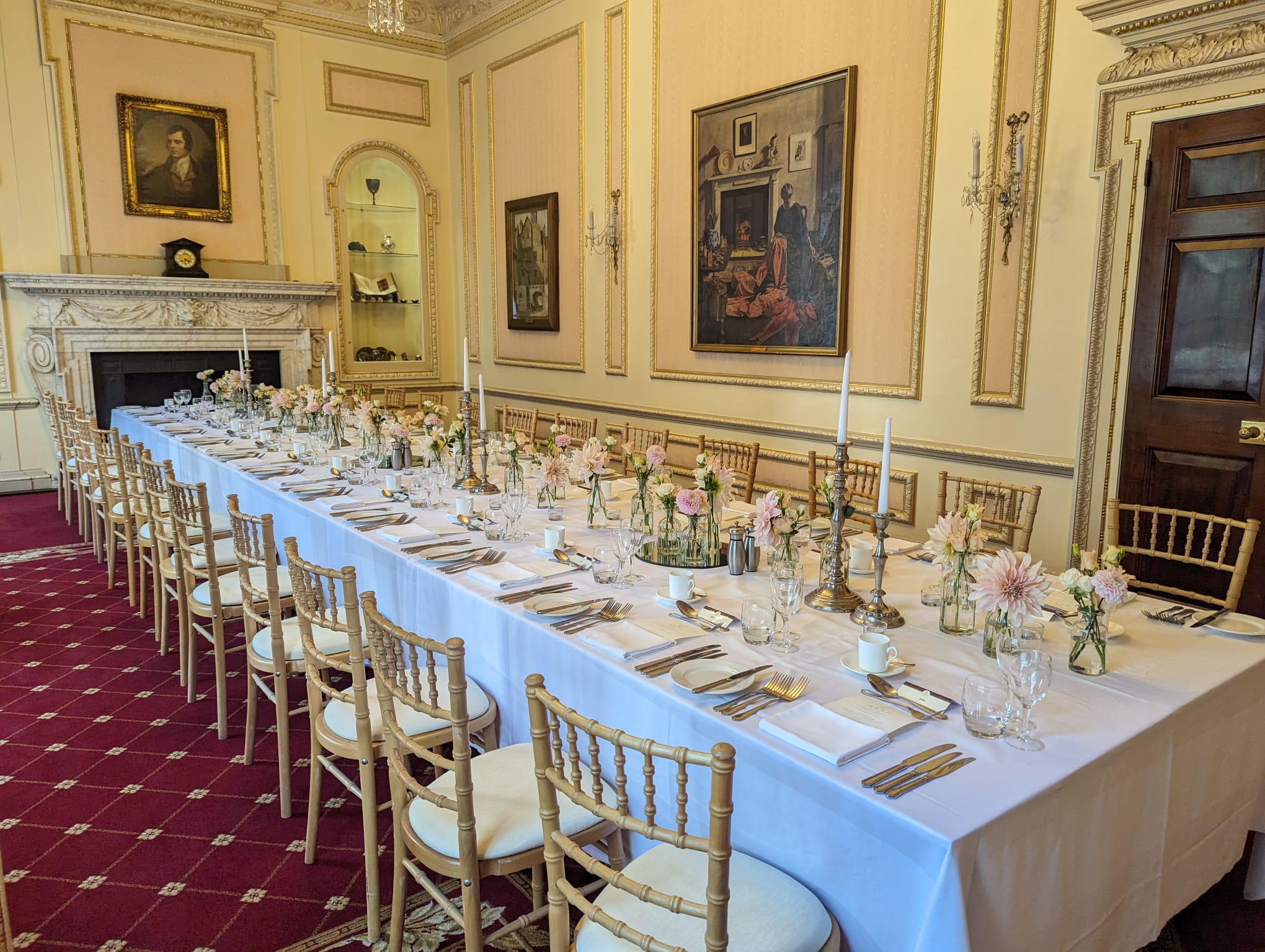 Elegant long table setup in Selkirk Room for formal dining and corporate events.