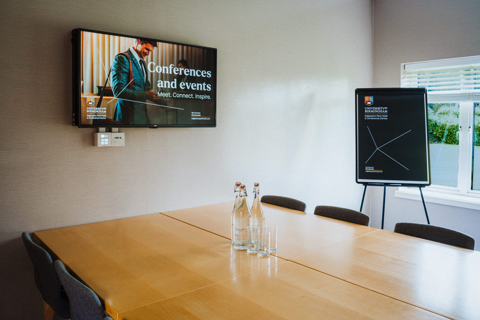 Falcon meeting room at Edgbaston Park, featuring a sleek table for conferences and events.