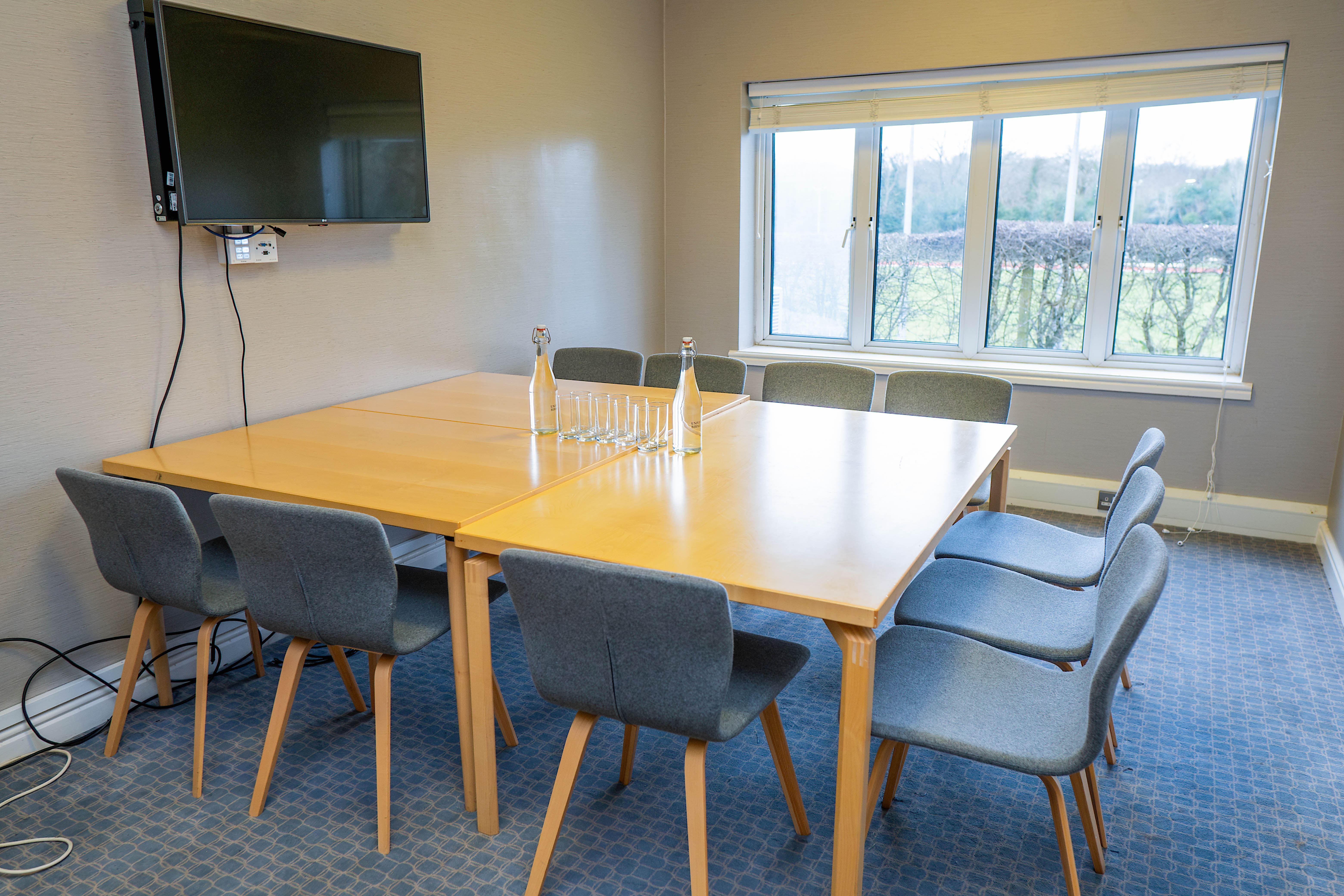 Skylark meeting room at Edgbaston Park Hotel, featuring a large wooden table and natural light.