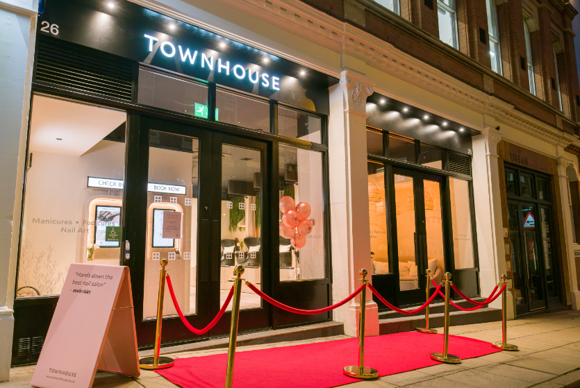 Townhouse Birmingham nail salon storefront with red carpet for VIP event and luxury retail experience.