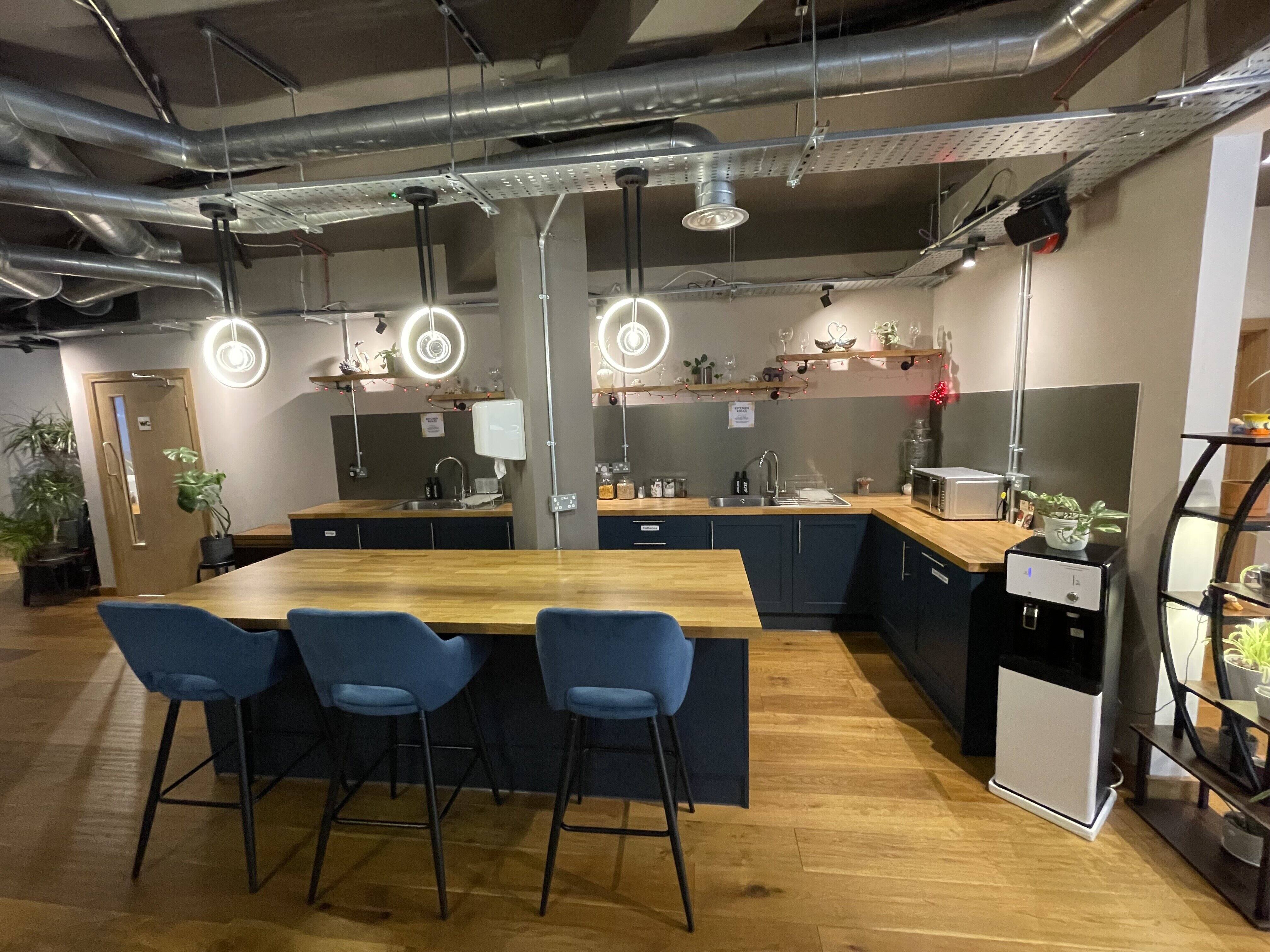Industrial-chic breakout area at The Lower Deck for networking and corporate events.