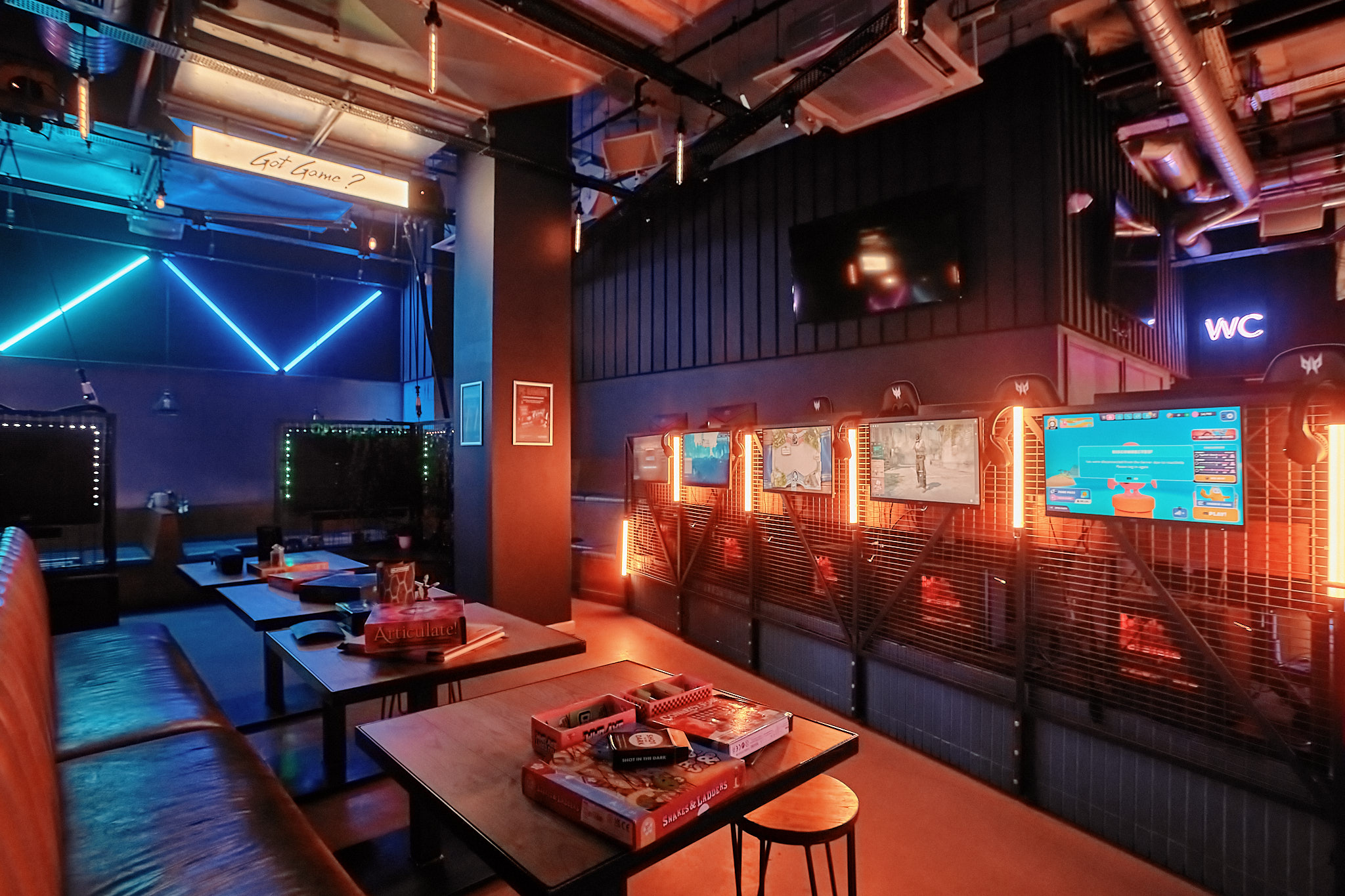 Vibrant modern venue with cozy seating, perfect for networking events and team-building activities.