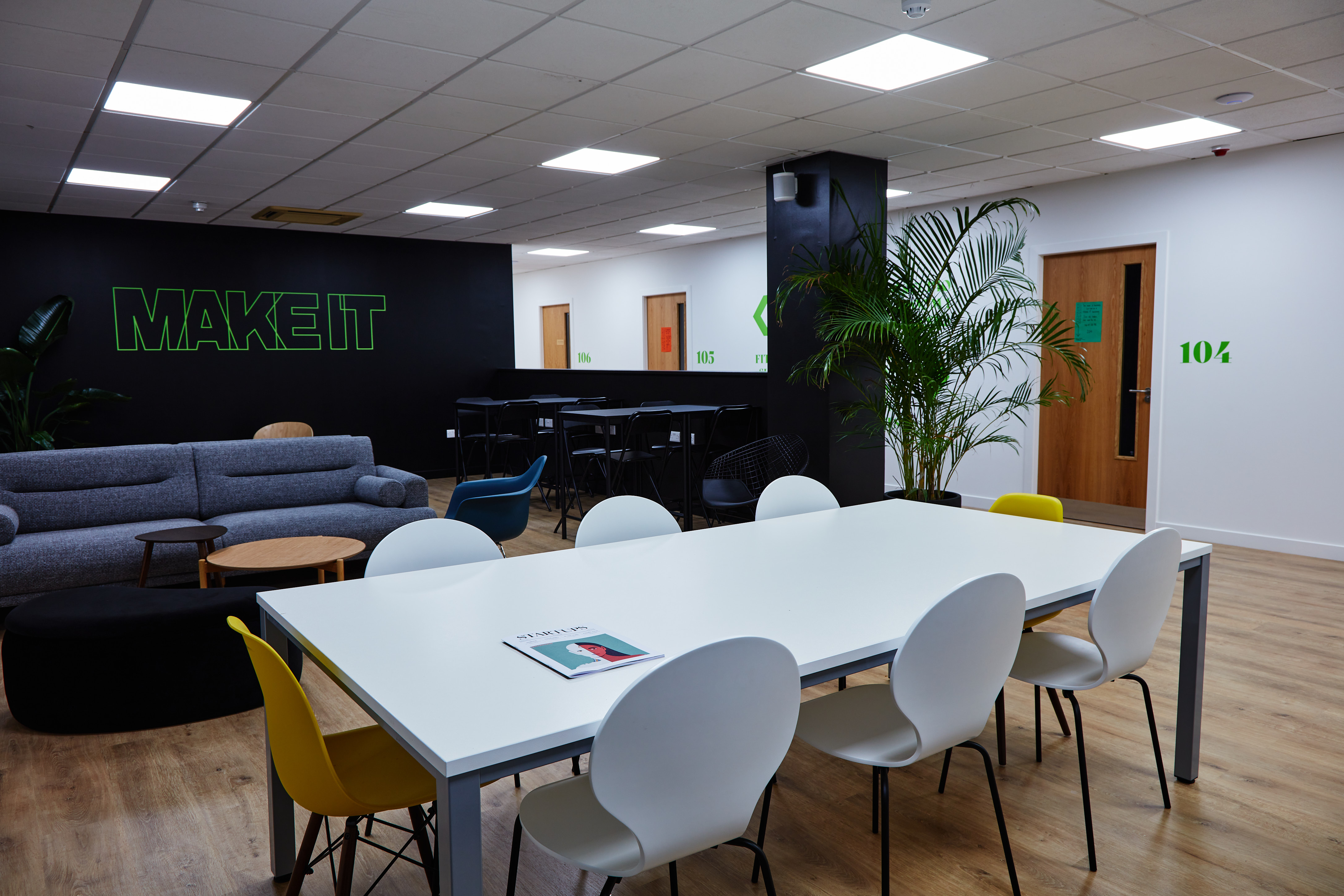 Modern meeting space at MAKE IT Barking with a sleek table for creative collaboration.