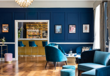 Elegant lounge with plush teal seating for Christmas parties in Old Palace Chester.